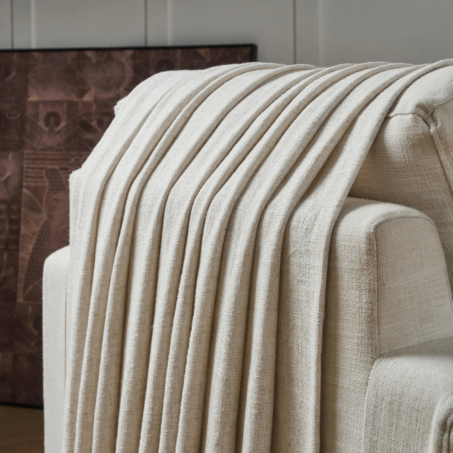 Ivory poly viscose linen curtain panel draped over a chair with a neutral background.