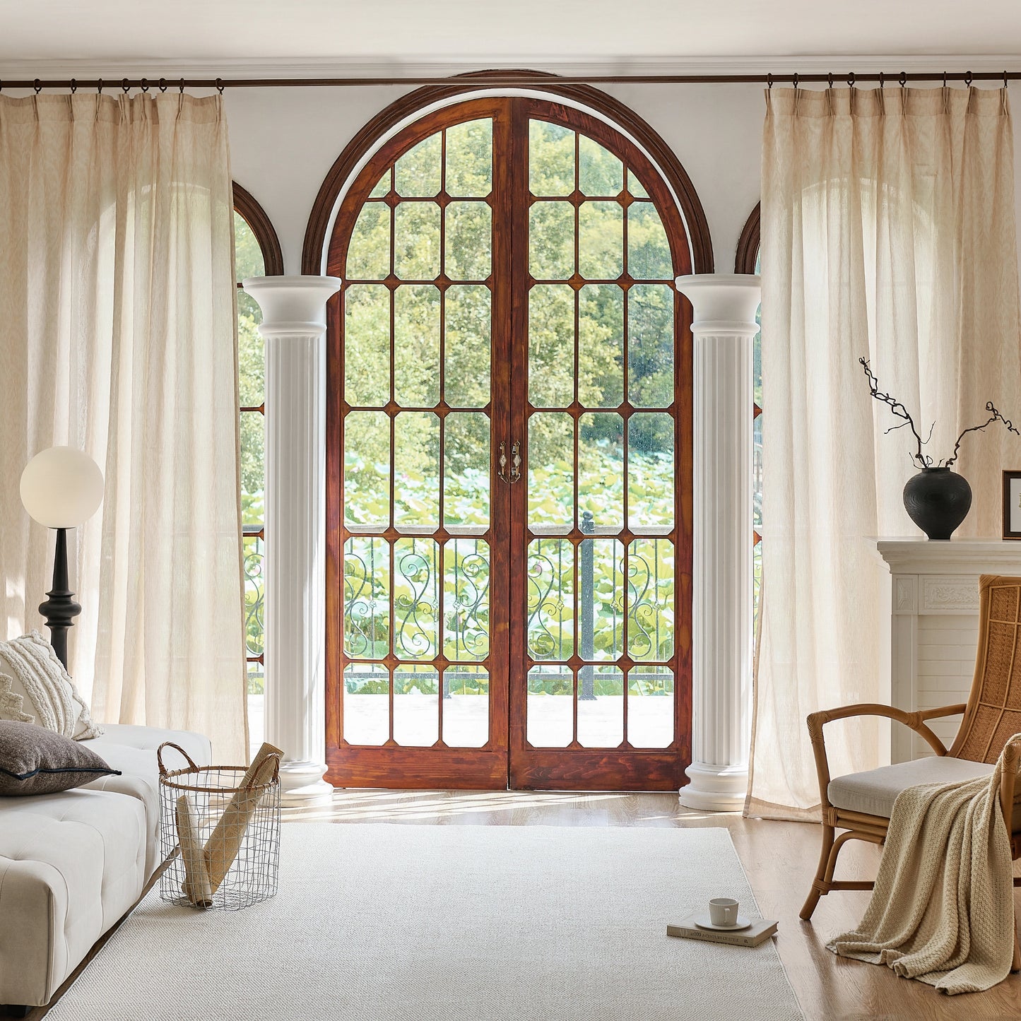 Living room with large wooden door, sand-hued wool gauze curtains with refined leaf-inspired raised texture.