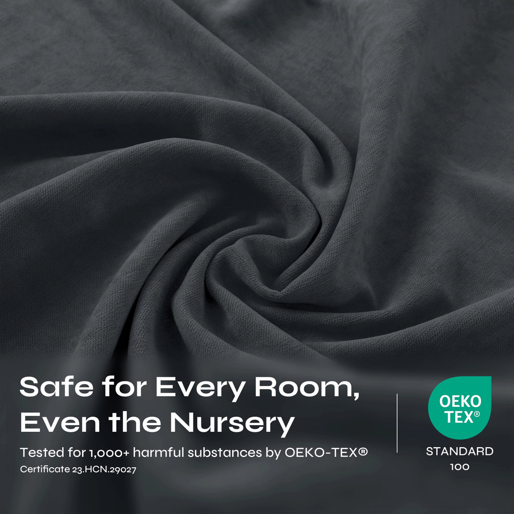 Dark charcoal gray textured fabric with soft draped folds and a fine woven surface.