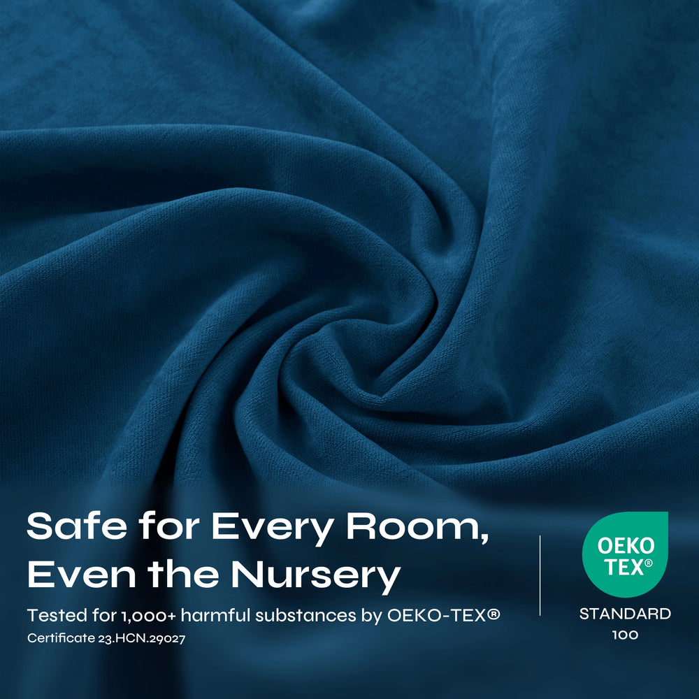 A close-up of draped blue fabric with a soft, textured surface and gentle folds.