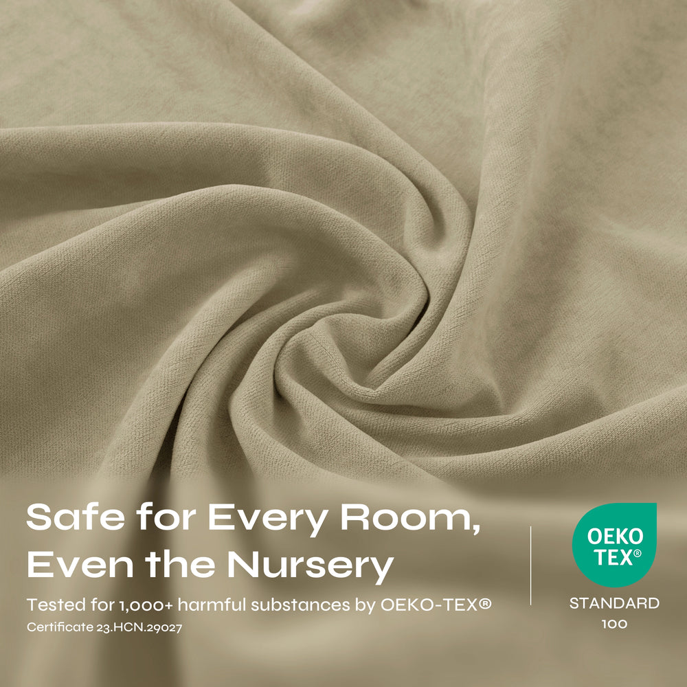 A close-up of draped beige fabric with a soft, textured weave and gentle folds.