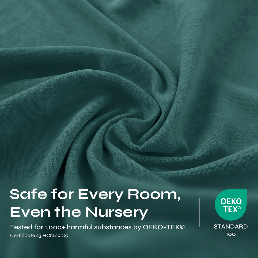 A close-up of draped teal fabric with a soft, textured weave and gentle folds filling the frame.