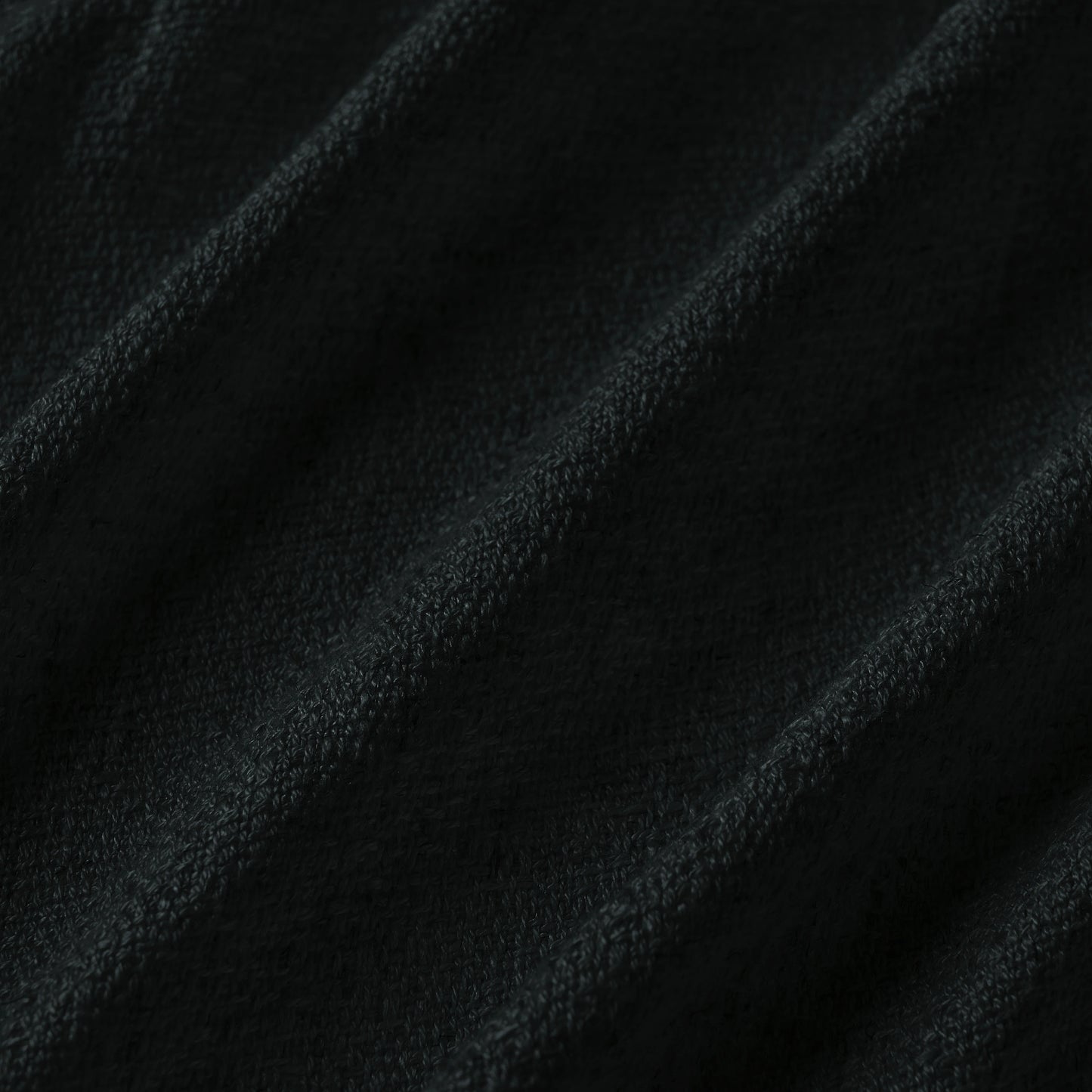 Charcoal black curtain detail in viscose-polyester-linen blend with soft, natural woven texture, ideal for curtains or décor.
