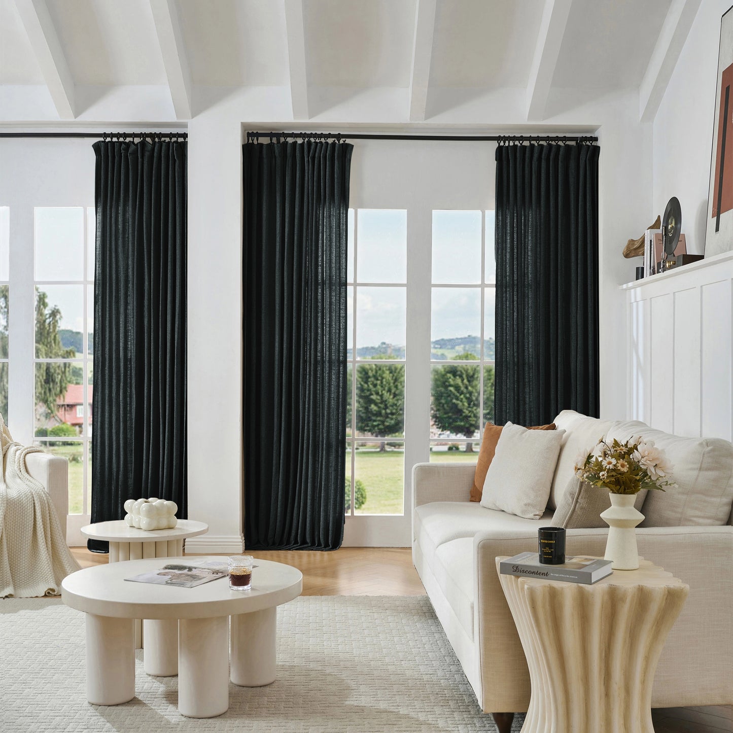 Modern living room with charcoal black viscose, polyester, and linen mixed fabric, a white sofa, and decorative accents.