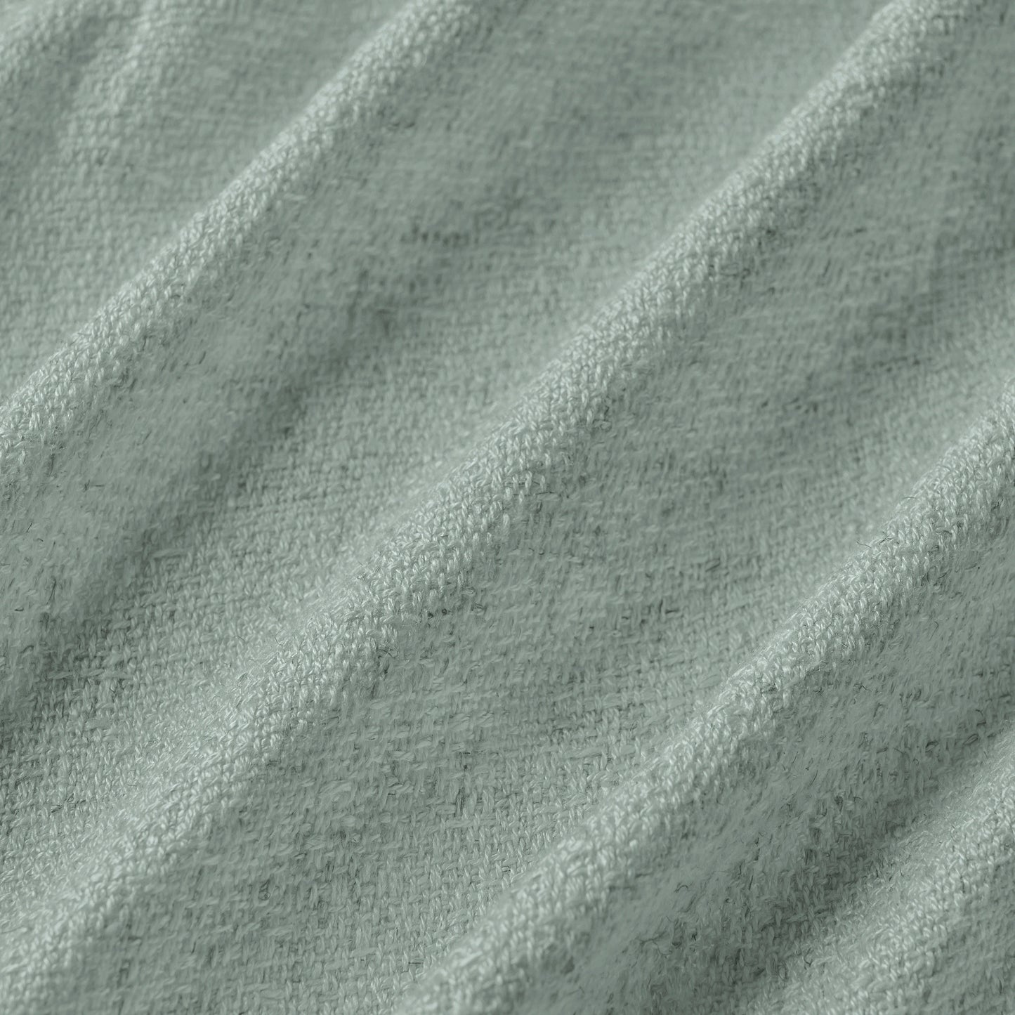 Pale blue curtain detail in viscose-polyester-linen blend with soft, natural woven texture, ideal for curtains or décor.
