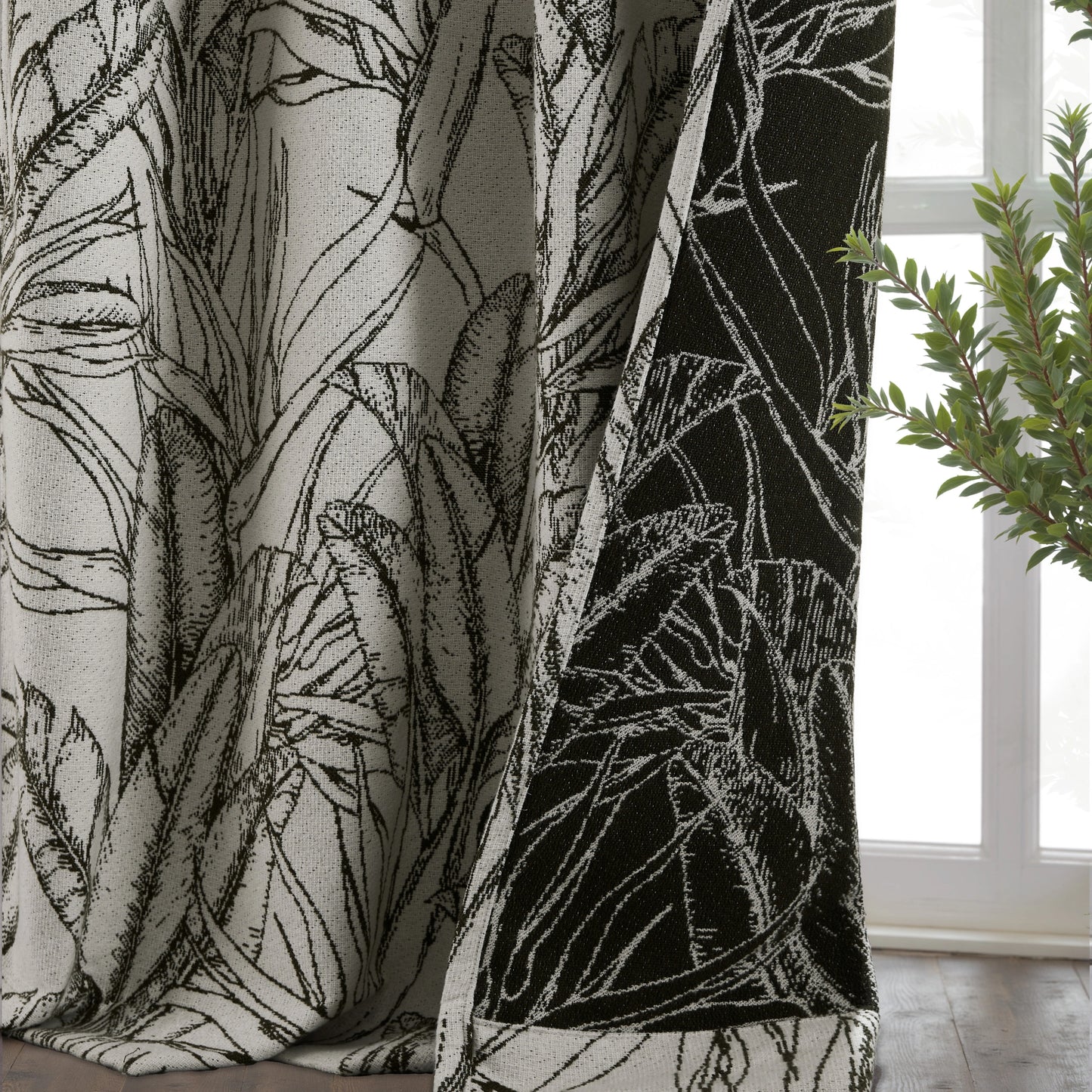 Close-up of boho plant sketch curtain fabric, textured in earthy green hues, showcasing elegant natural decorative design.