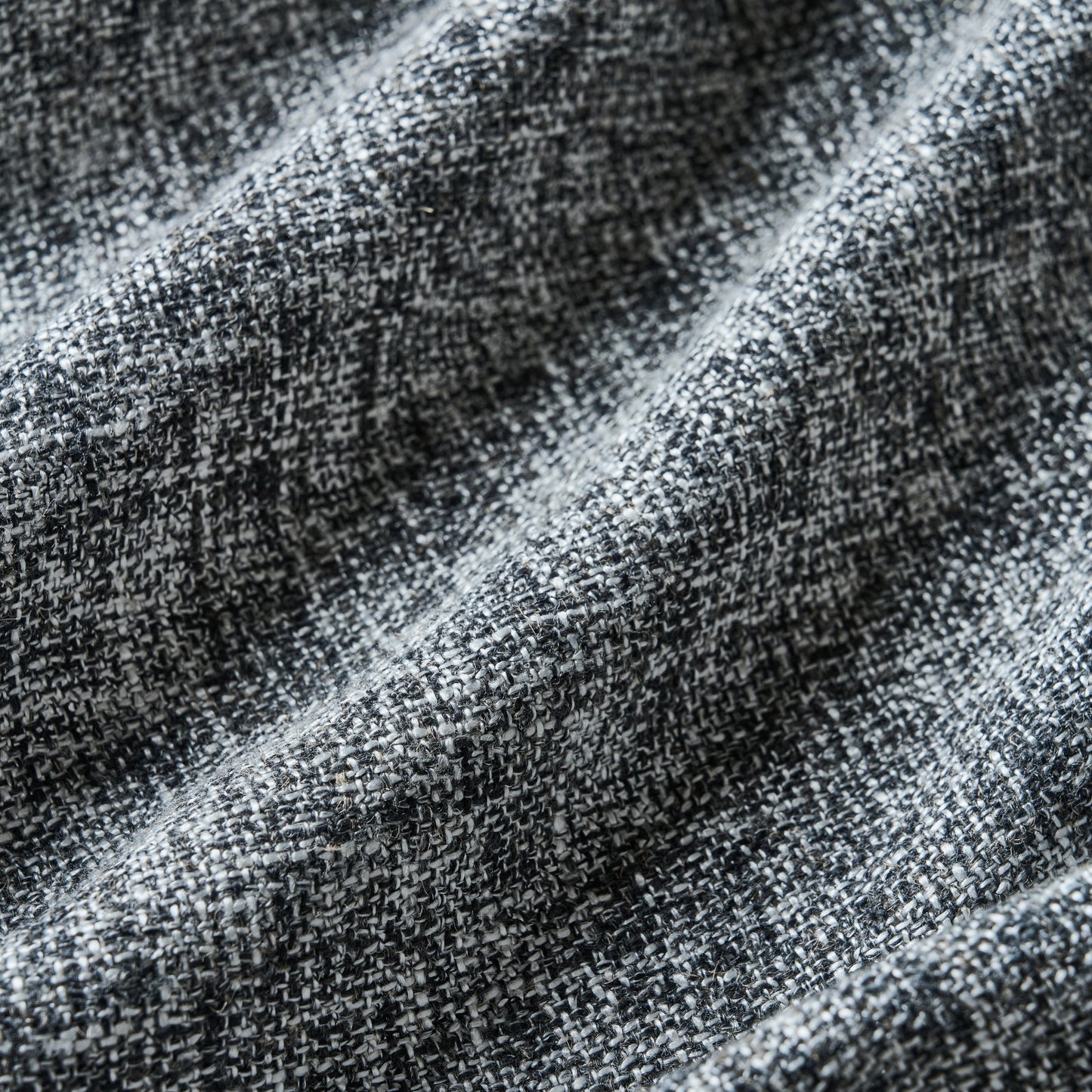 Salt and pepper gray poly-viscose-linen blend curtain detail showing fabric texture.