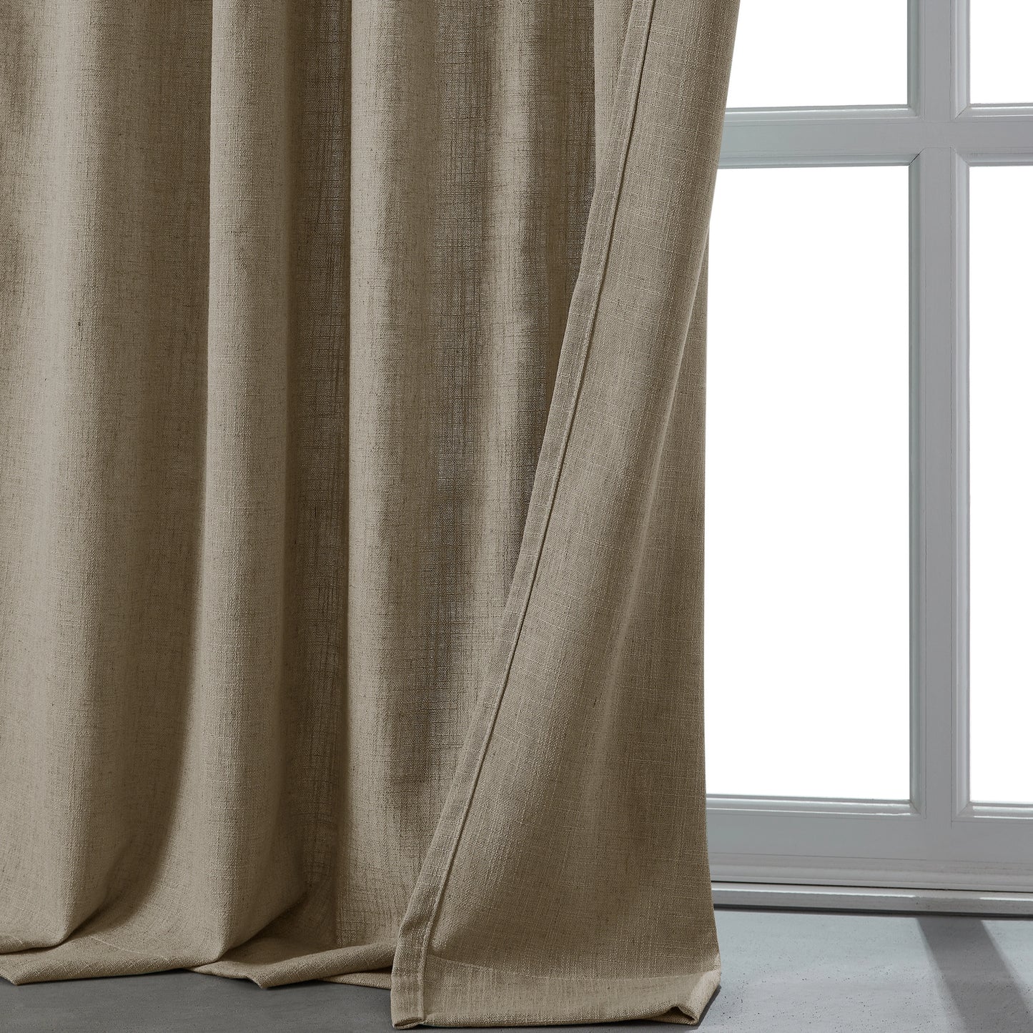 Warm camel linen-polyester blend lightweight curtain in front of a window.