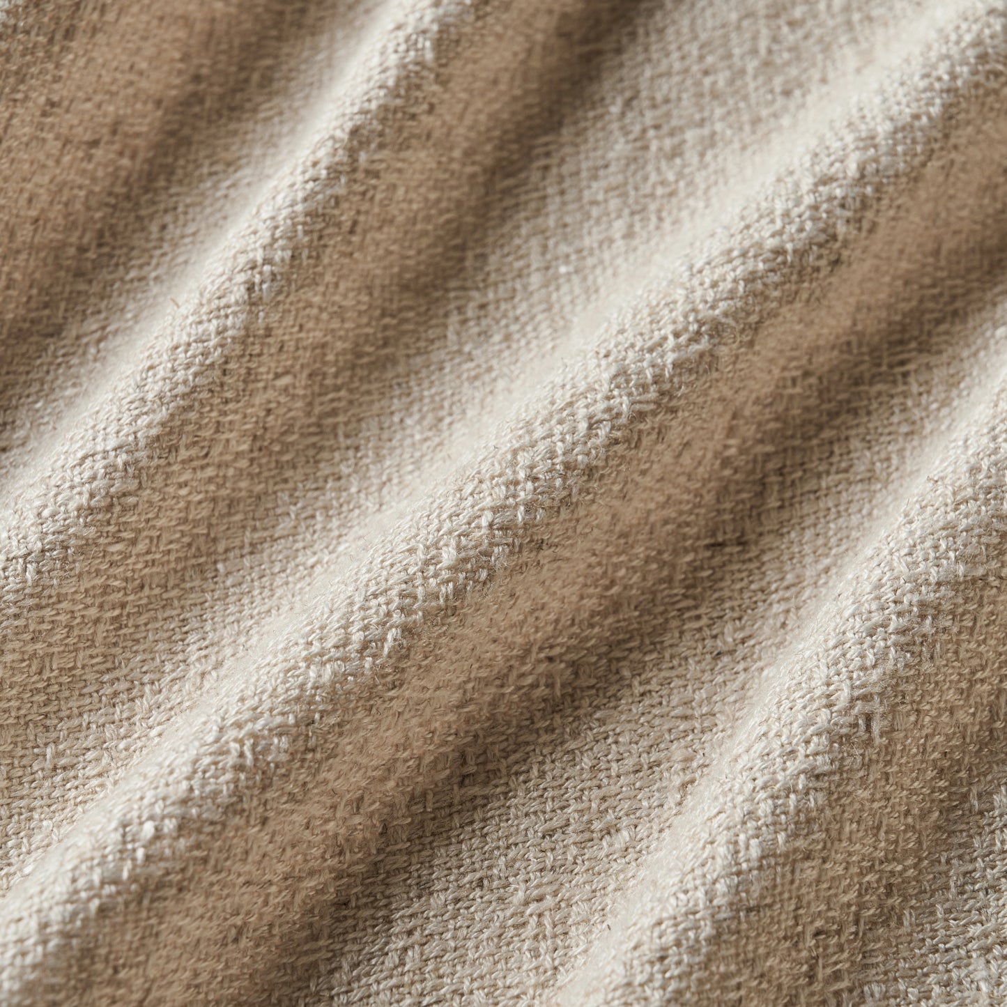 Light camel curtain detail in viscose-polyester-linen blend with soft, natural woven texture, ideal for curtains or décor.