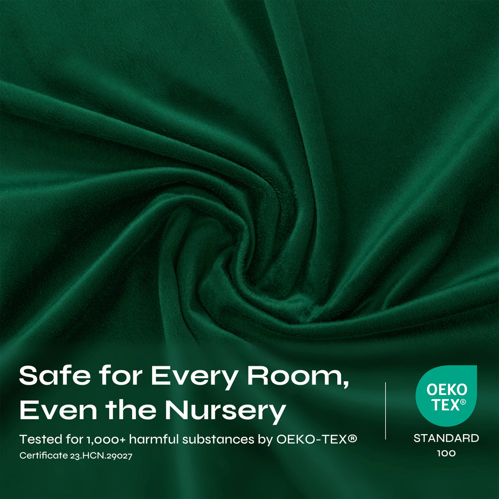 Dark green velvet fabric draped in a spiral pattern, showing its soft, plush texture and sheen.