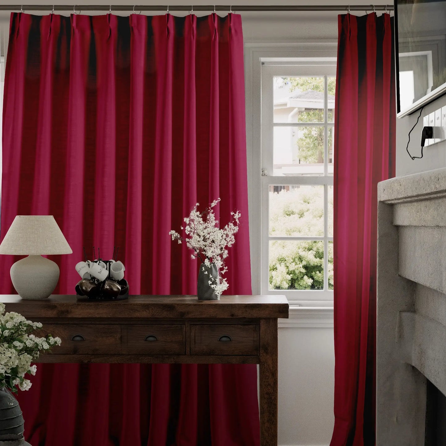 Ruby curtains in a room with a wooden table and decorative items.