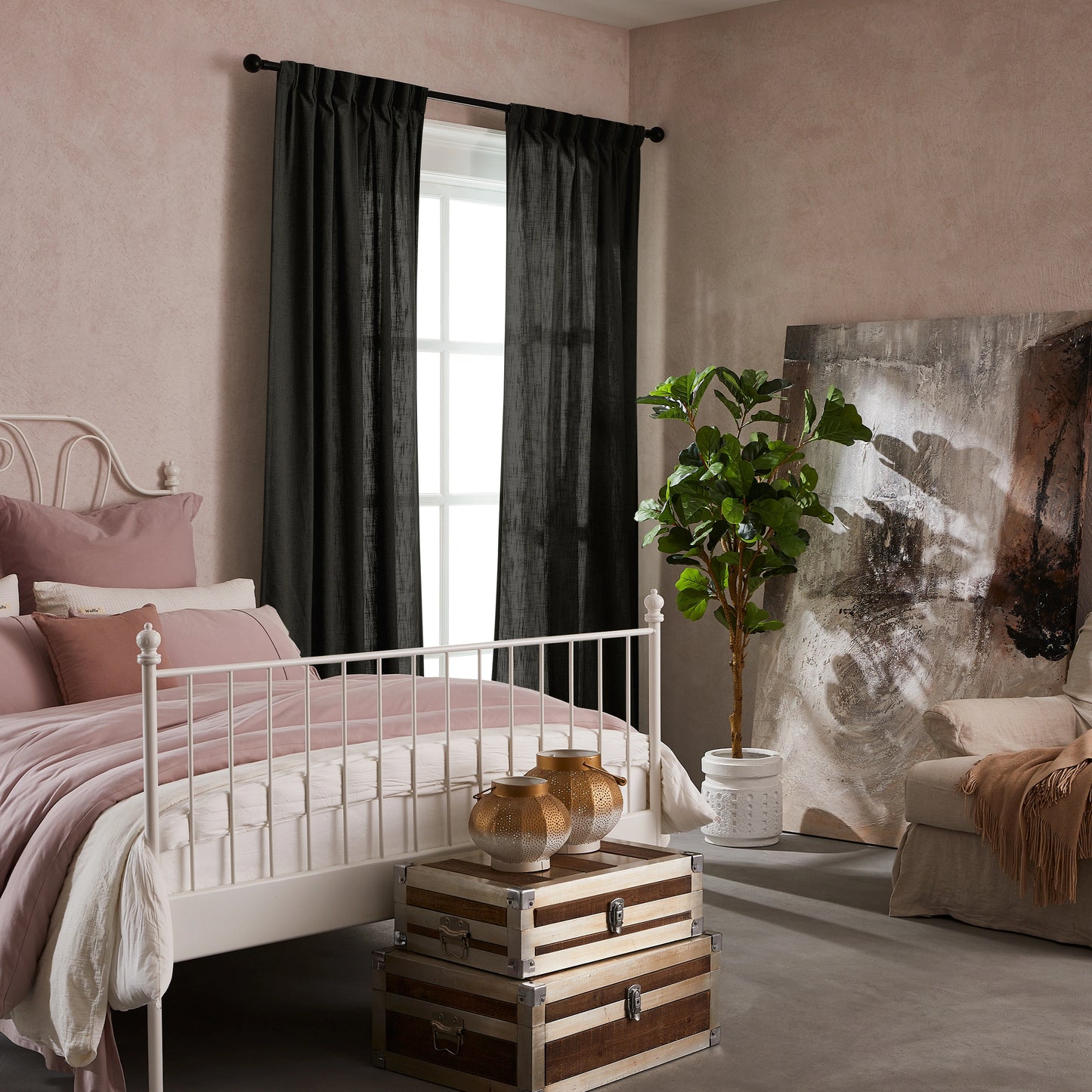 Bedroom with pink walls, white bed, decorative elements, and elegant soft dark gray linen-polyester mix pleated curtains.