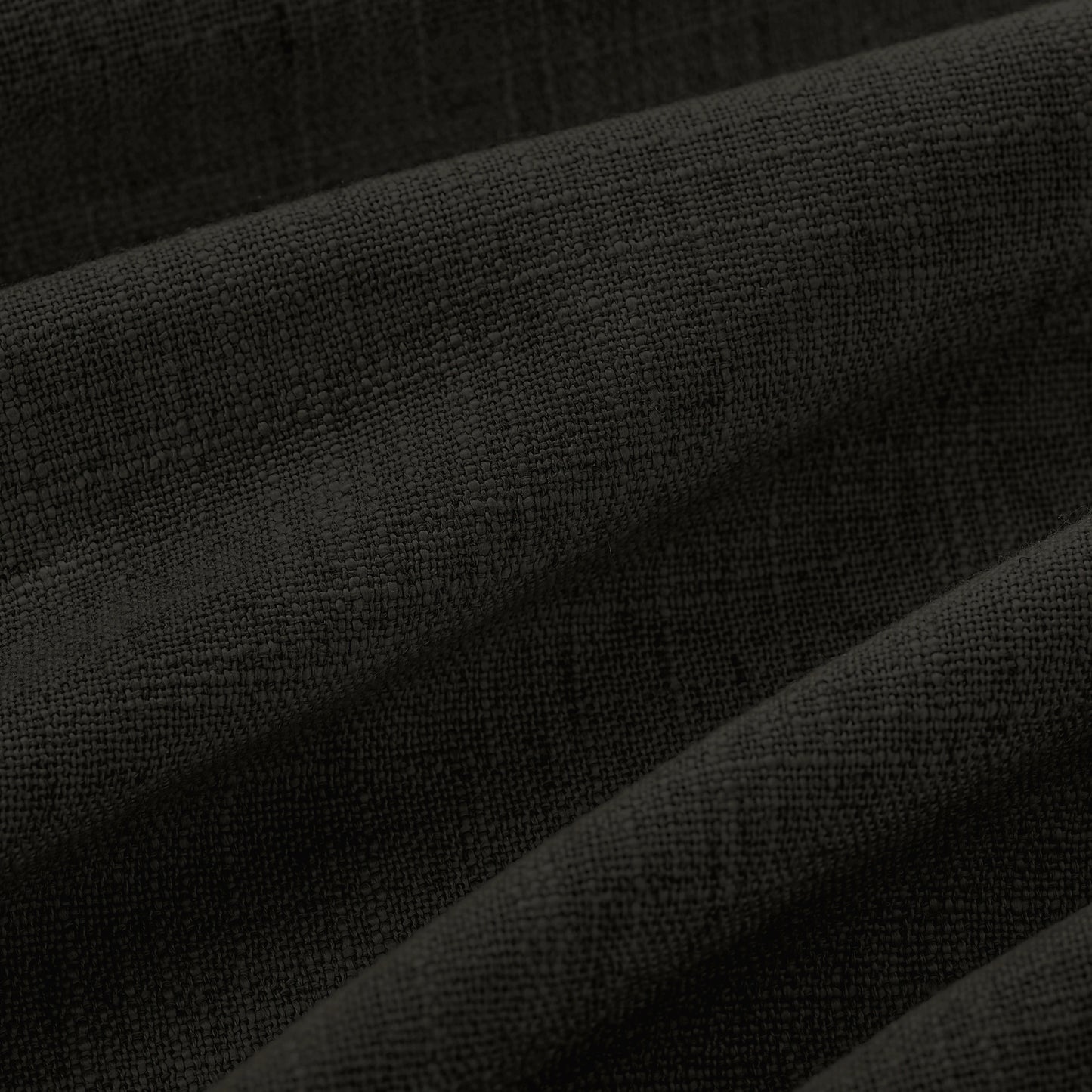 Detail of textured charcoal gray polyester-linen woven curtains.