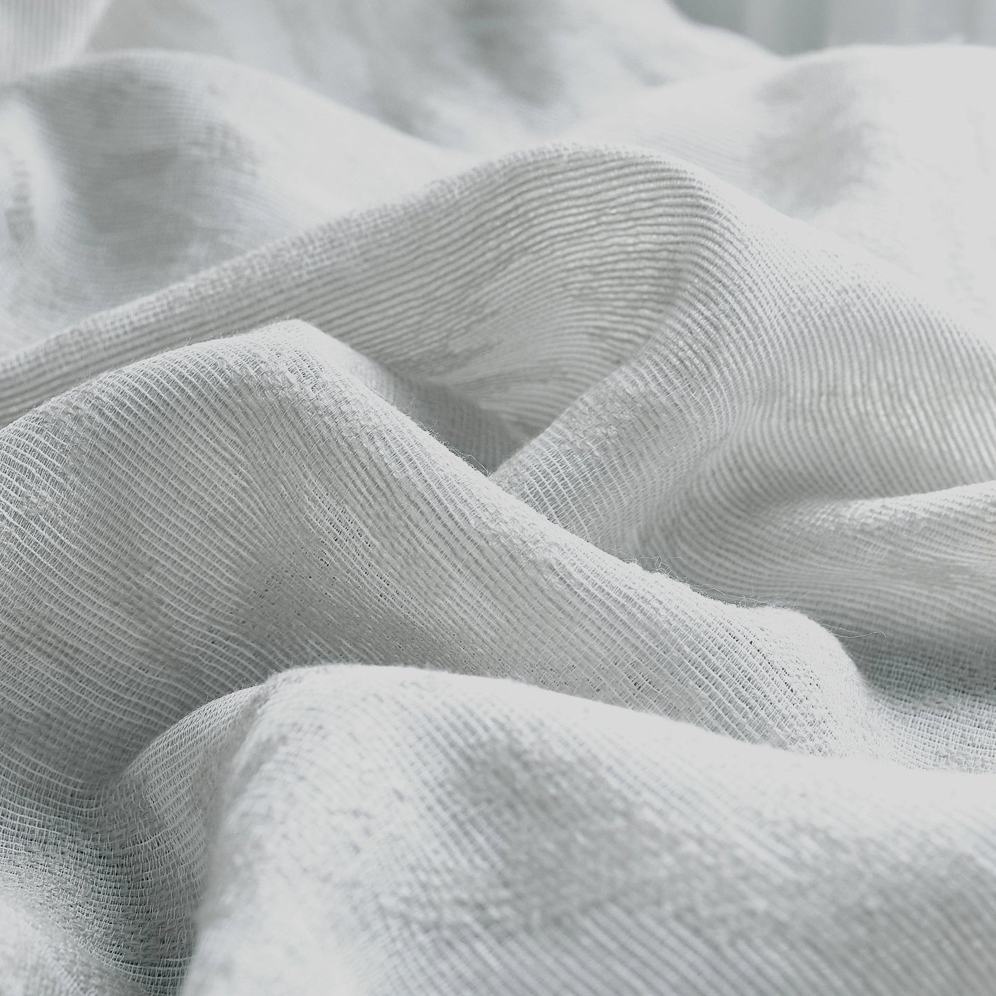 Close-up of textured light gray fabric