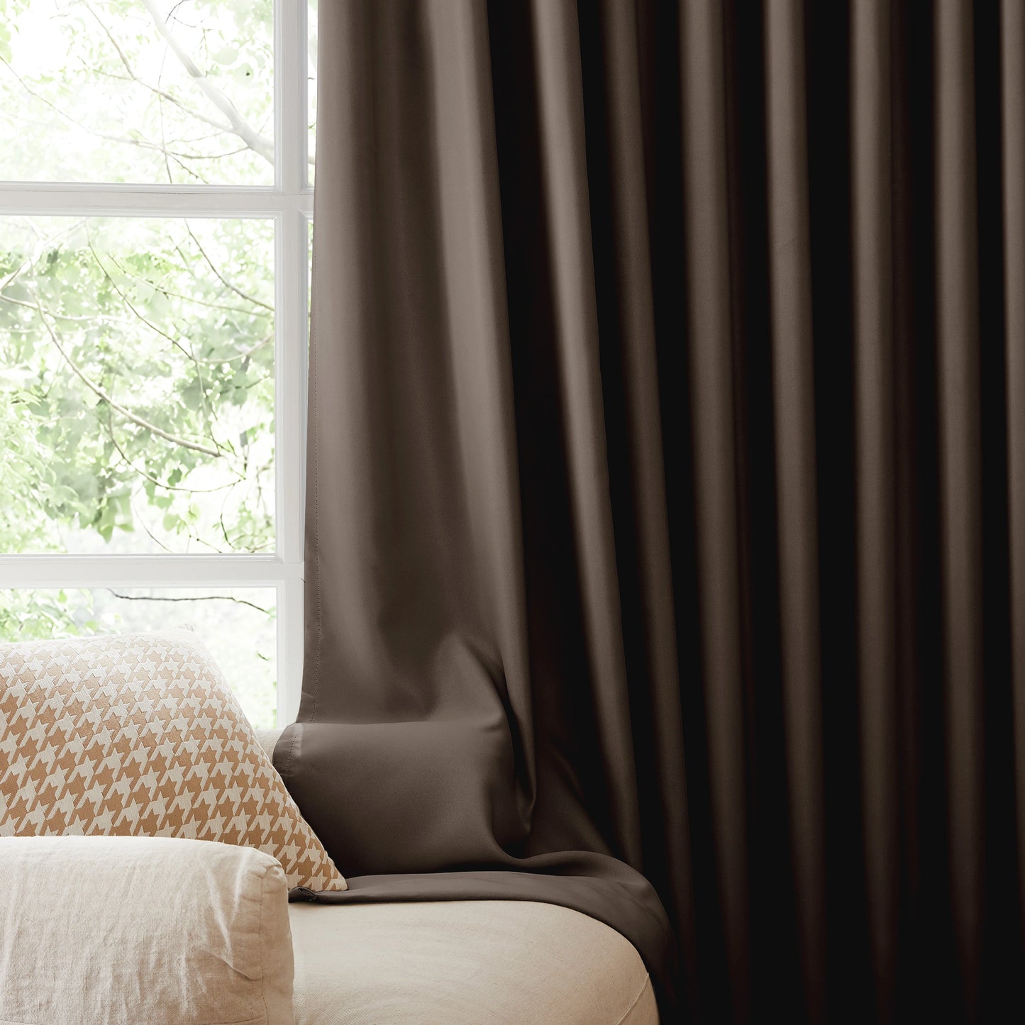 Fire retardant mocha gray blackout curtains, room darkening window panels behind sofa area