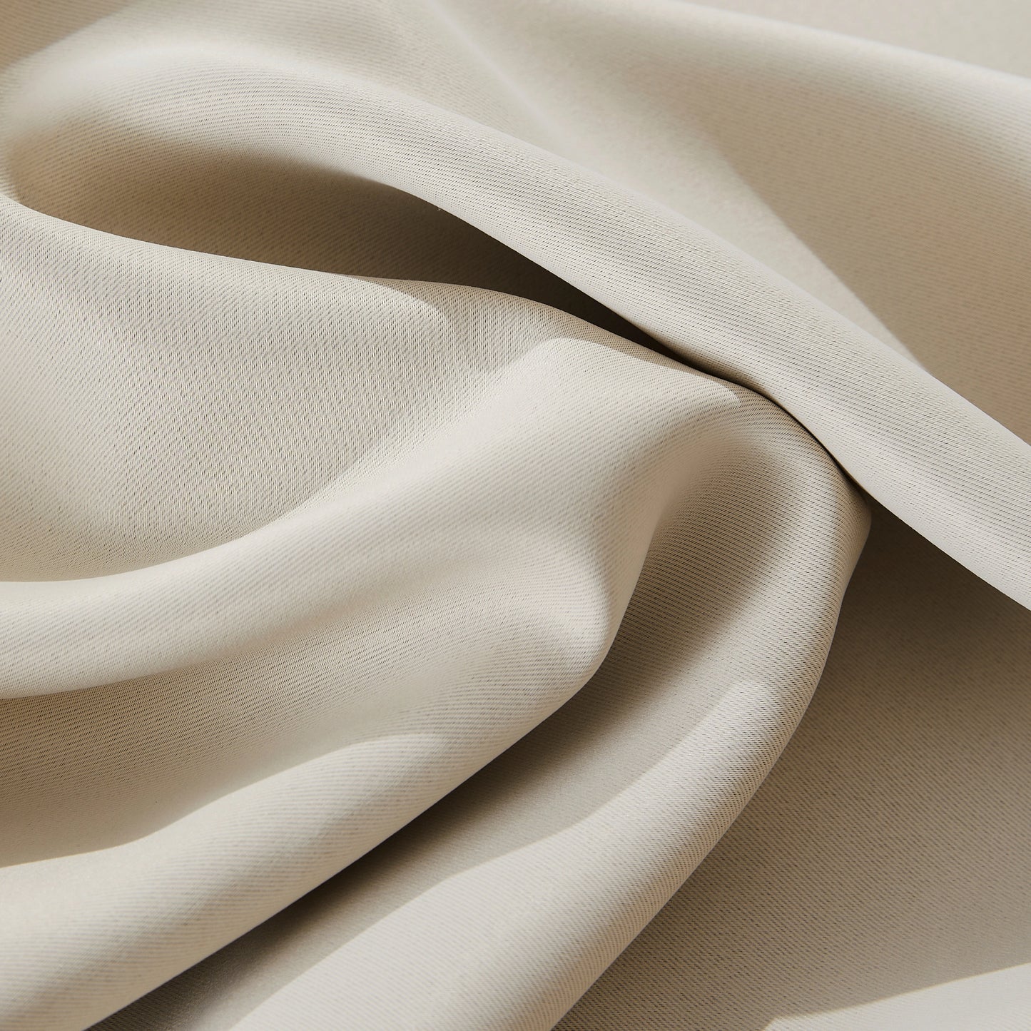 Close-up of flame-retardant ivory curtain fabric, soft textured thermal insulated material