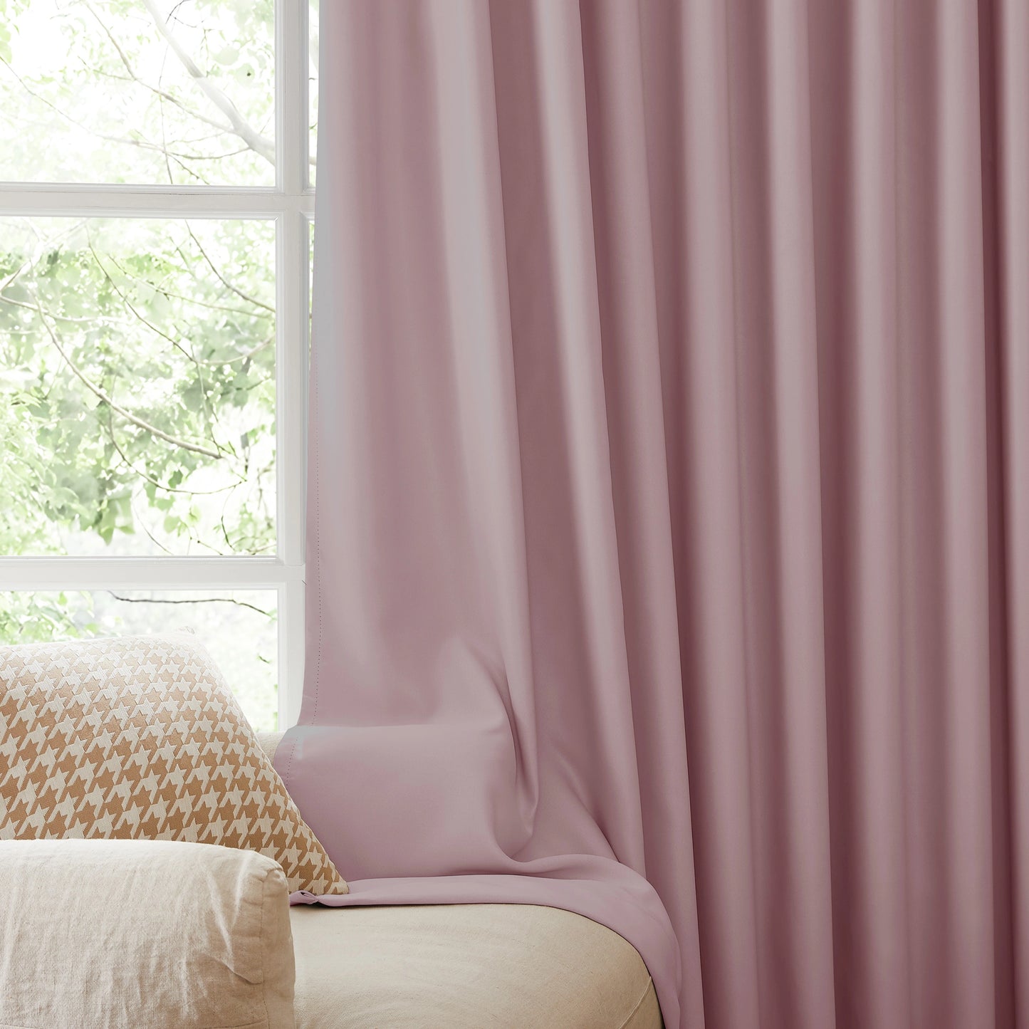 Fire retardant carnation dusty pink blackout curtains, room darkening window panels behind sofa area