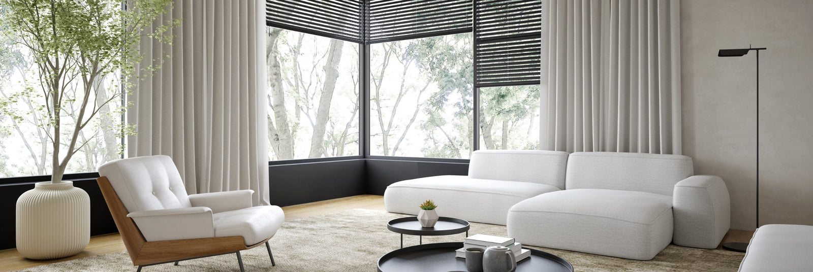 Modern living room with white sofa and curtains.