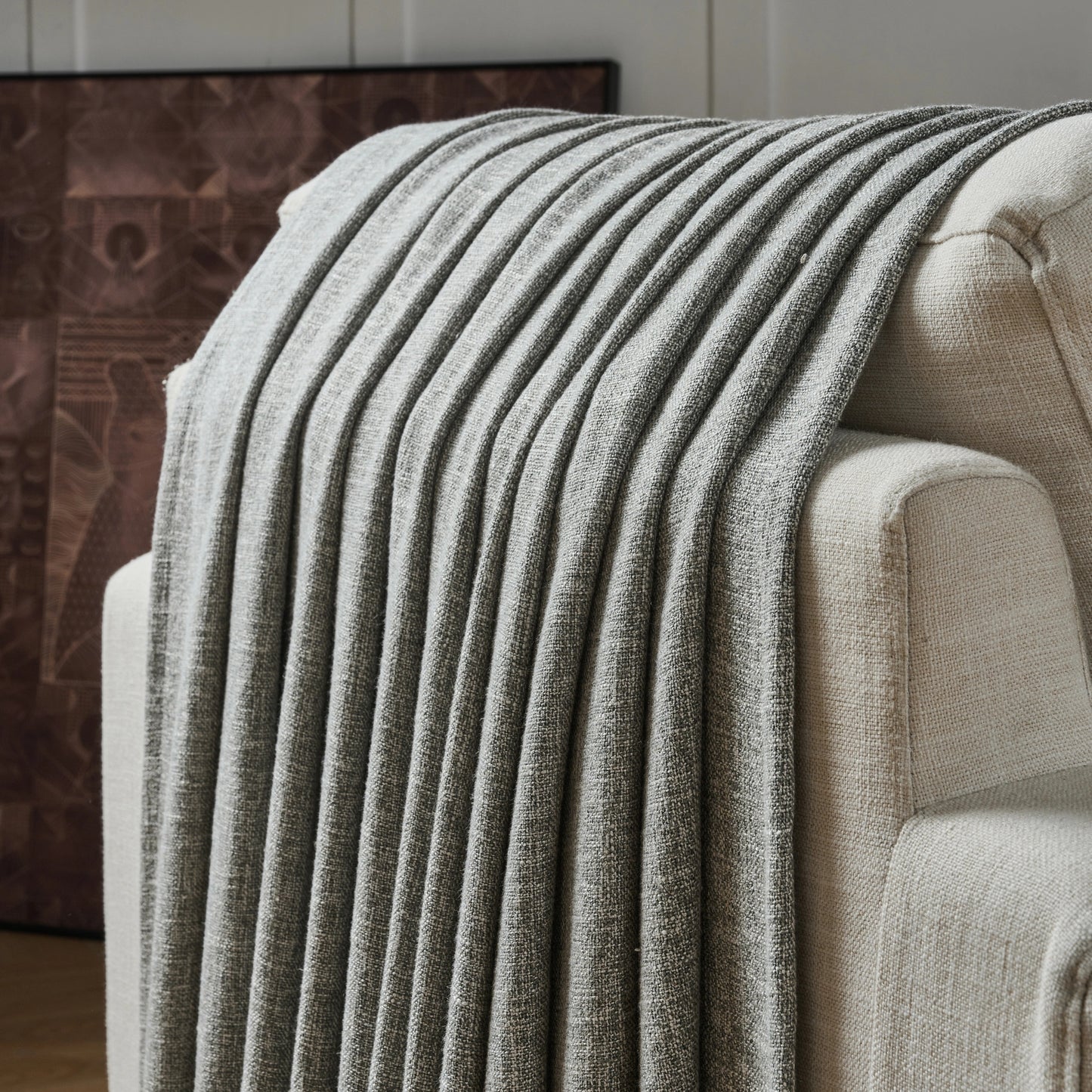 Oat gray poly viscose linen curtain panel draped over a chair with a neutral background.