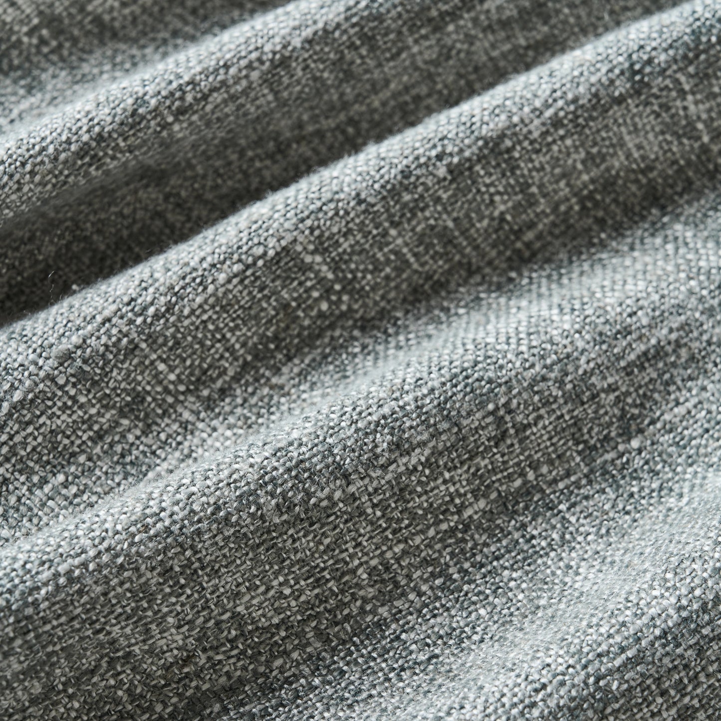 Soft gray poly-viscose-linen blend curtain detail showing fabric texture.