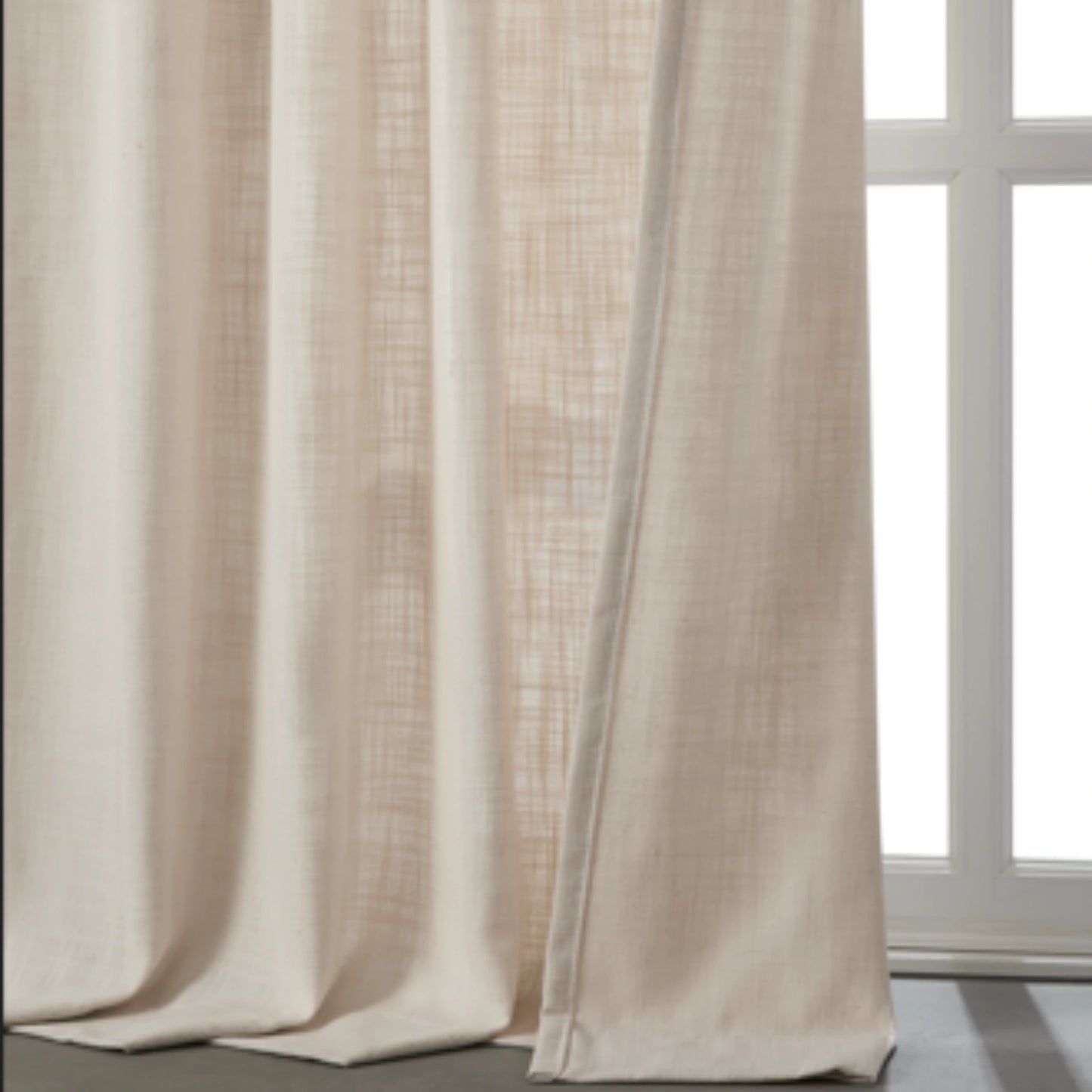 Soft ivory linen-polyester blend lightweight curtain in front of a window.