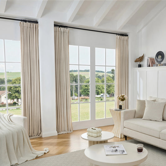 Living room with soft off-white viscose, polyester, and linen mixed fabric curtain, white sofa, and tables.