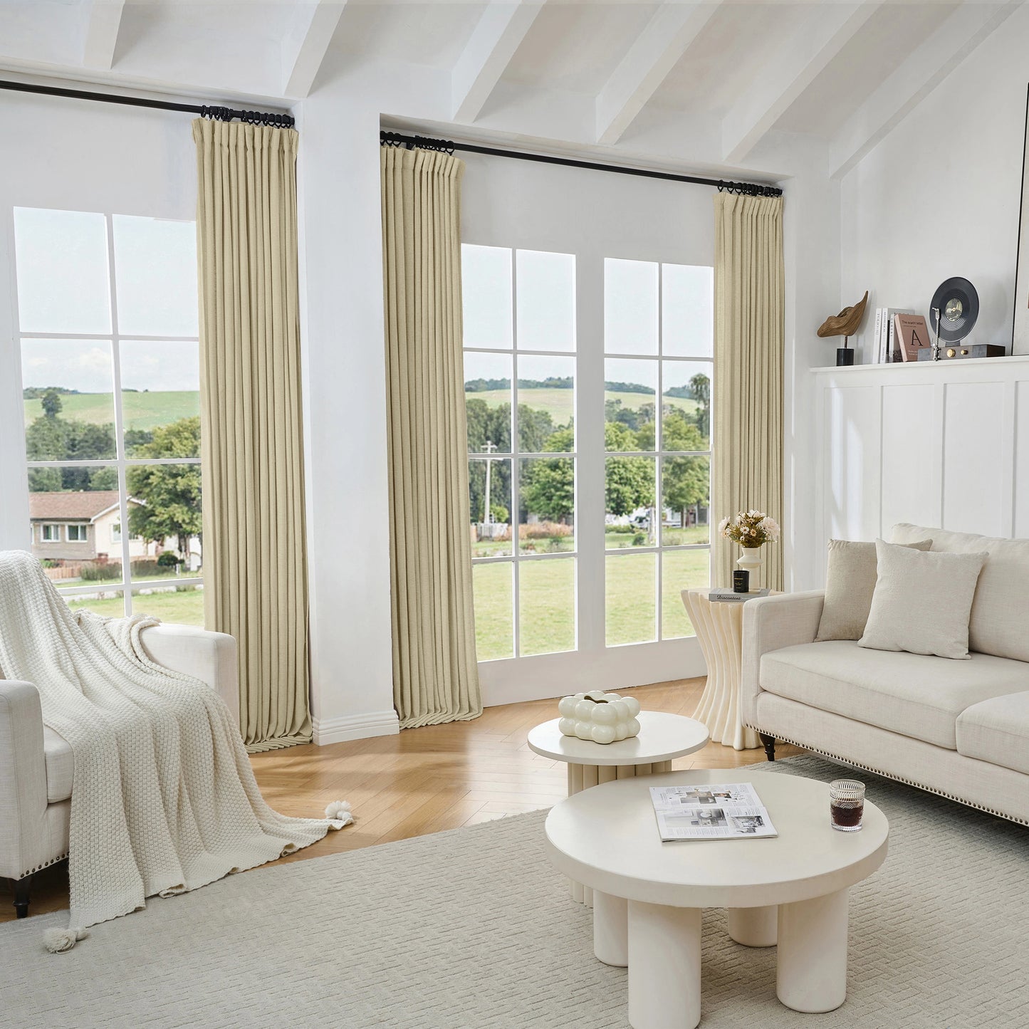 Living room with light khaki viscose, polyester, and linen mixed fabric curtain, white sofa, and tables.