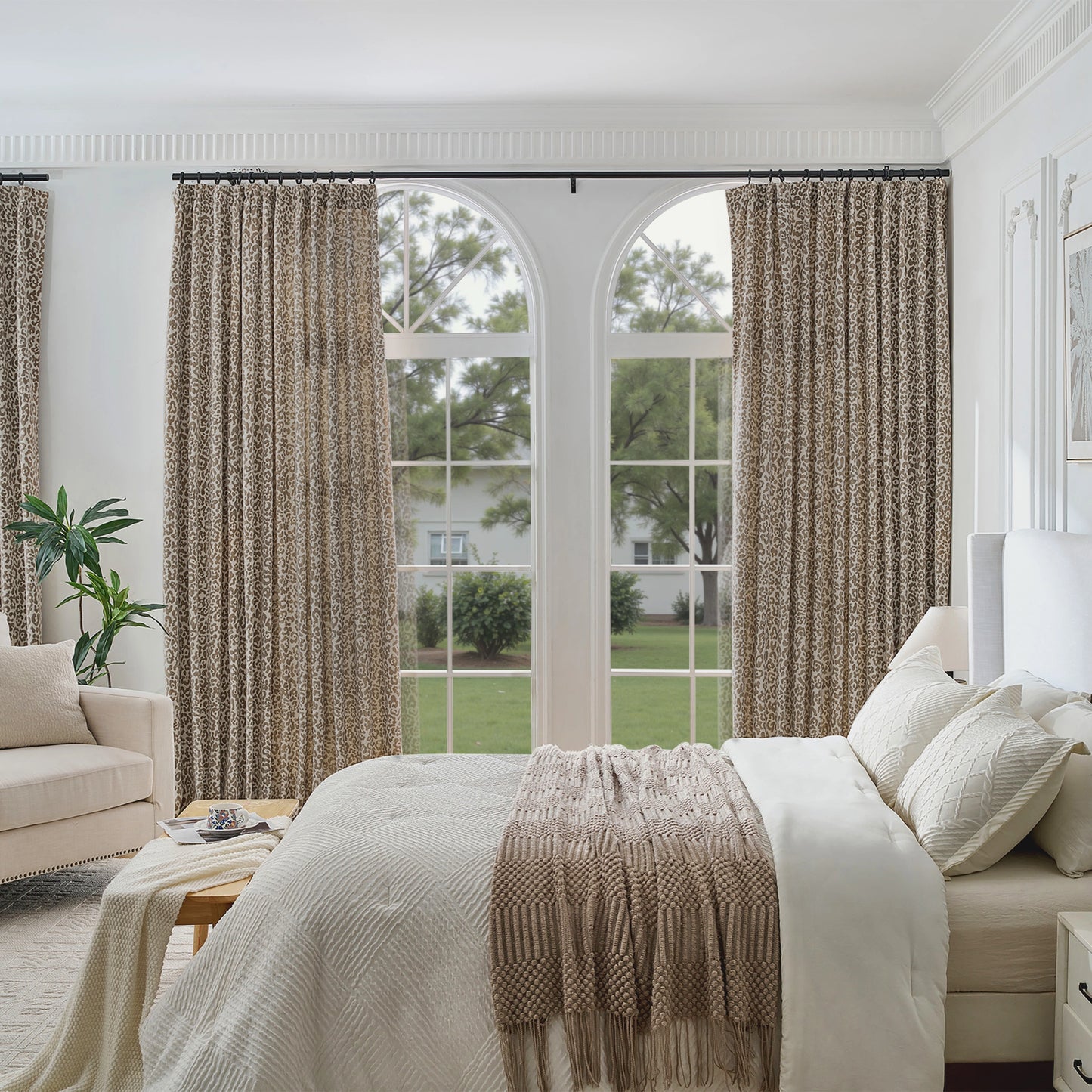 Bedroom styled with leopard-pattern modern drapery, with a sofa in the room.