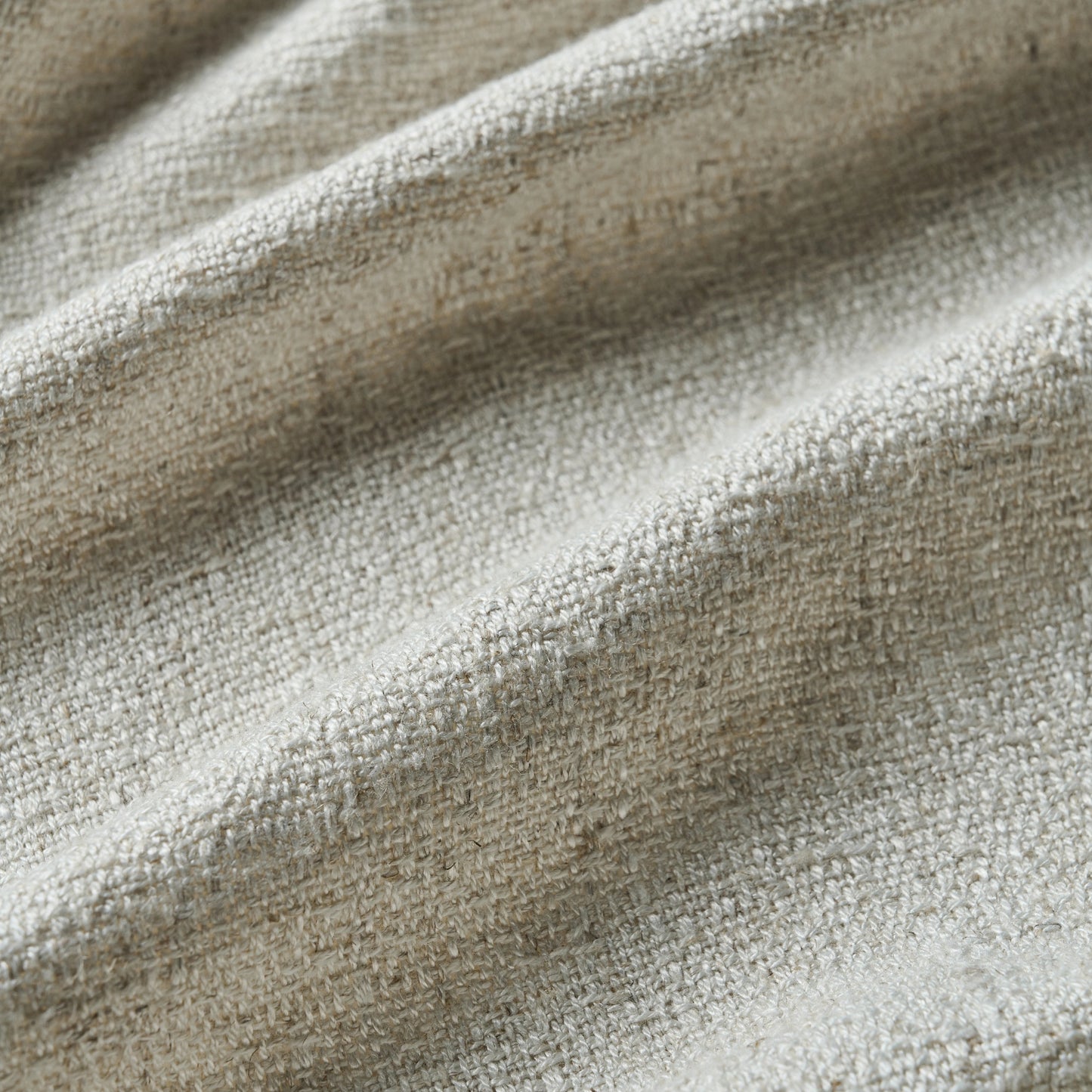 Pale camel curtain detail in viscose-polyester-linen blend with soft, natural woven texture, ideal for curtains or décor.