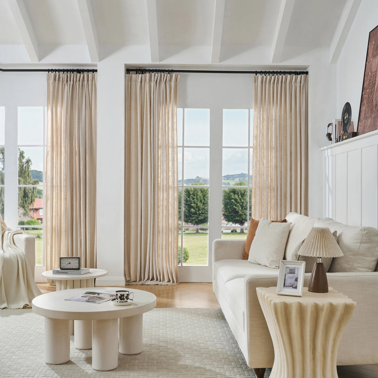 Modern living room with warm camel viscose, polyester, and linen mixed fabric, a white sofa, and decorative accents.