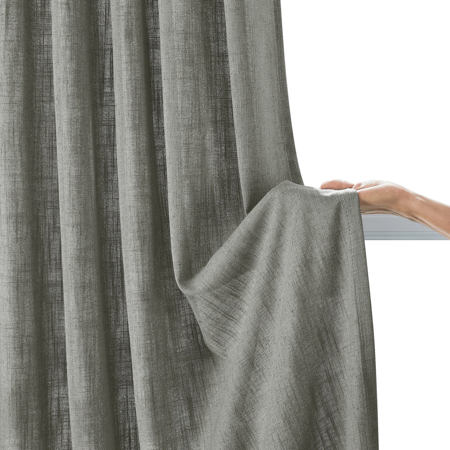 Clean light gray linen-polyester fabric window panel held by hand on a neutral background.