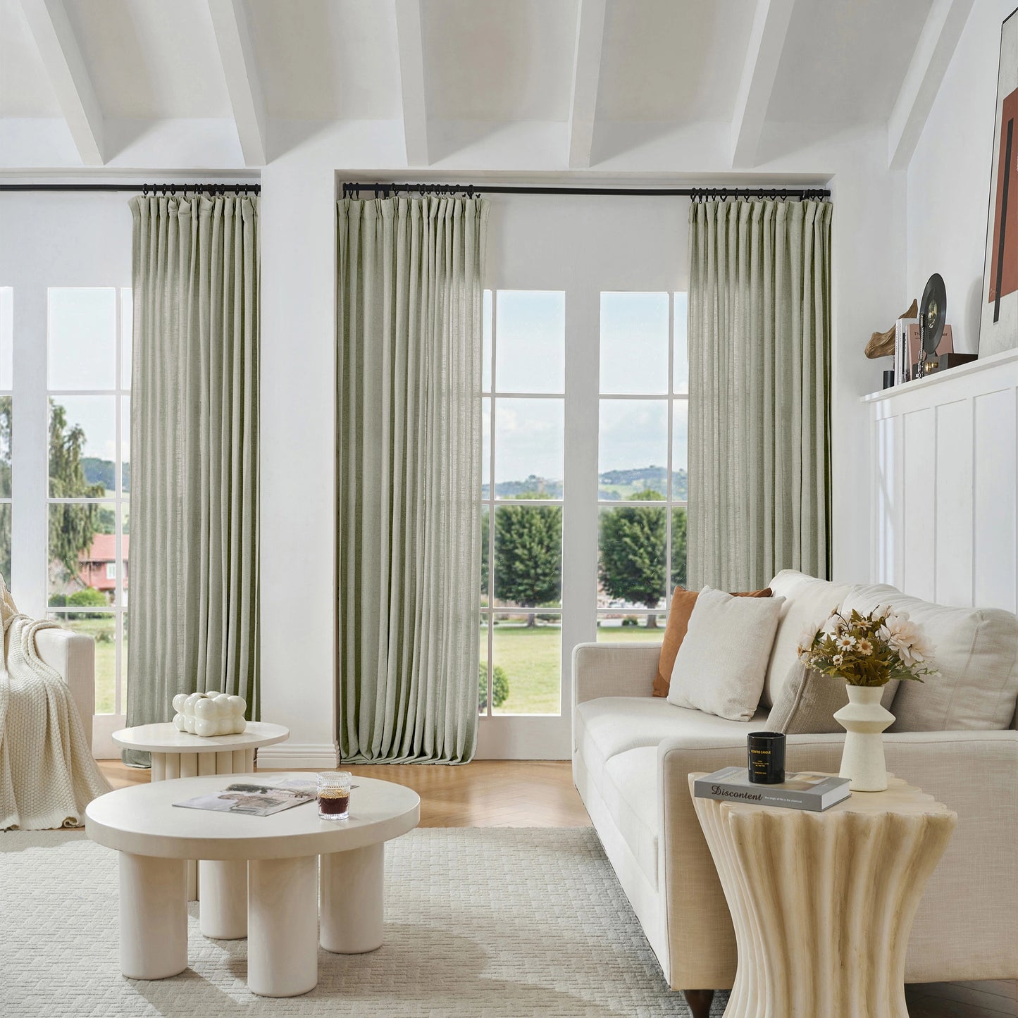 Modern living room with soft gray viscose, polyester, and linen mixed fabric, a white sofa, and decorative accents.