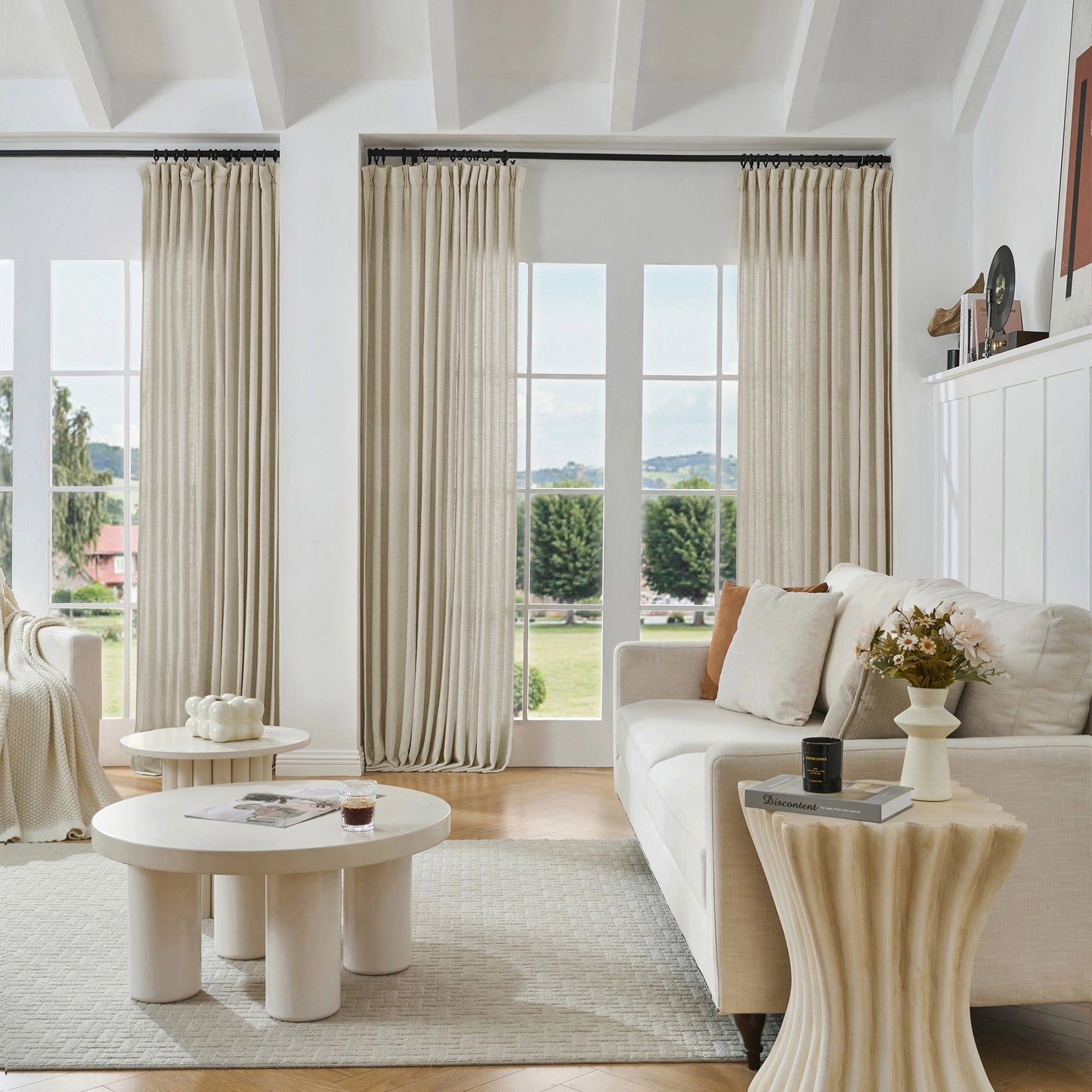Modern living room with warm ivory viscose, polyester, and linen mixed fabric, a white sofa, and decorative accents.