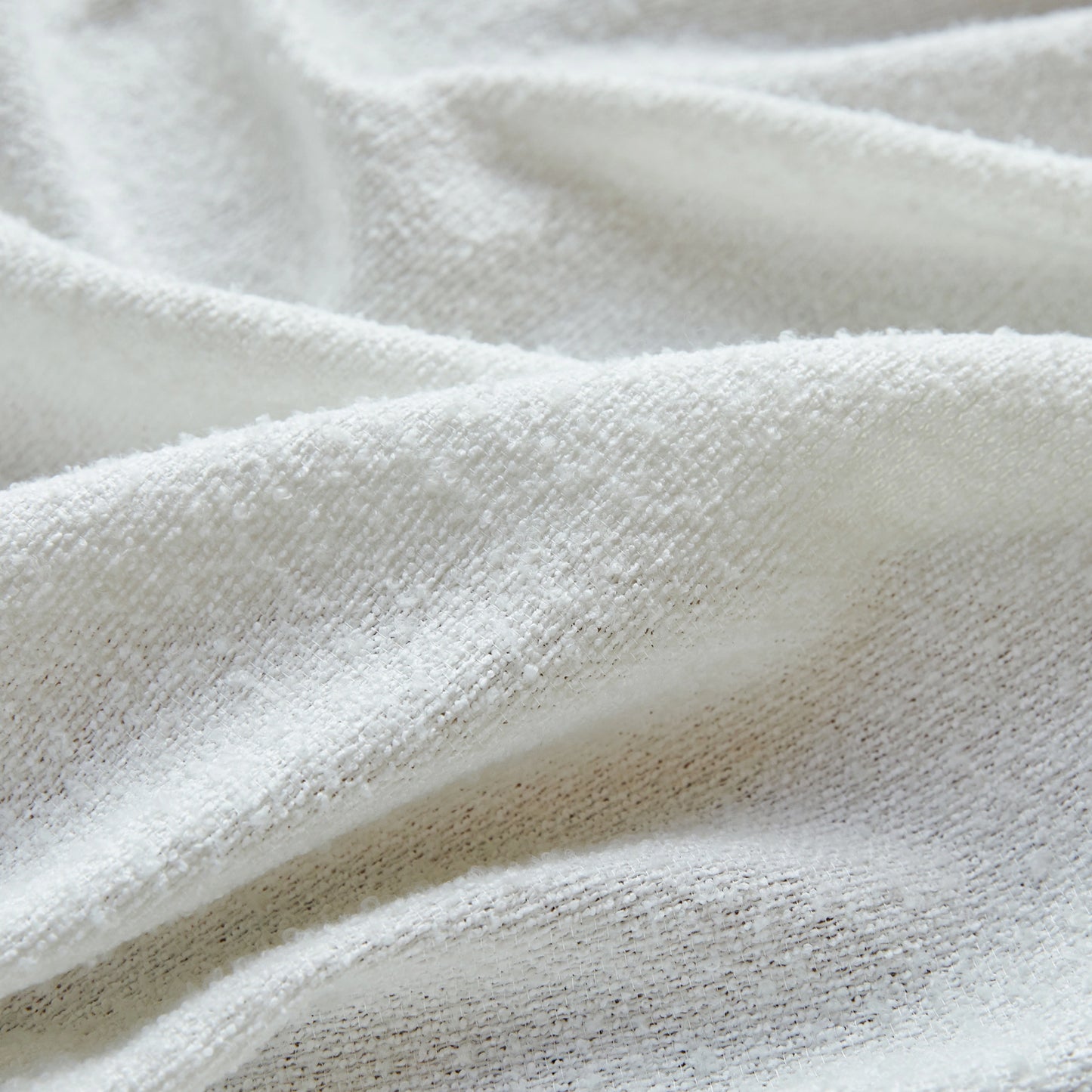 Detailed view of snow terry gauze curtain fabric, sheer airy weave creating an elegant modern style.