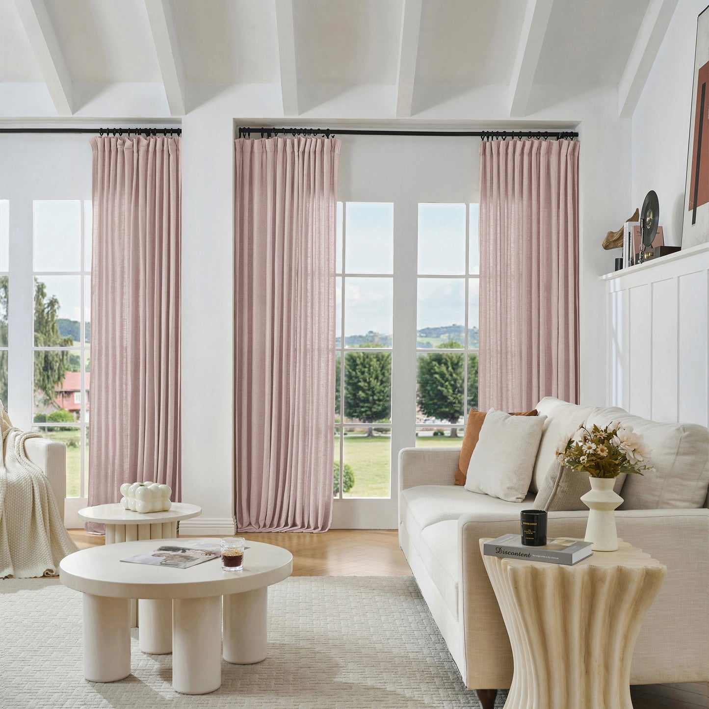 Modern living room with blush pink viscose, polyester, and linen mixed fabric, a white sofa, and decorative accents.