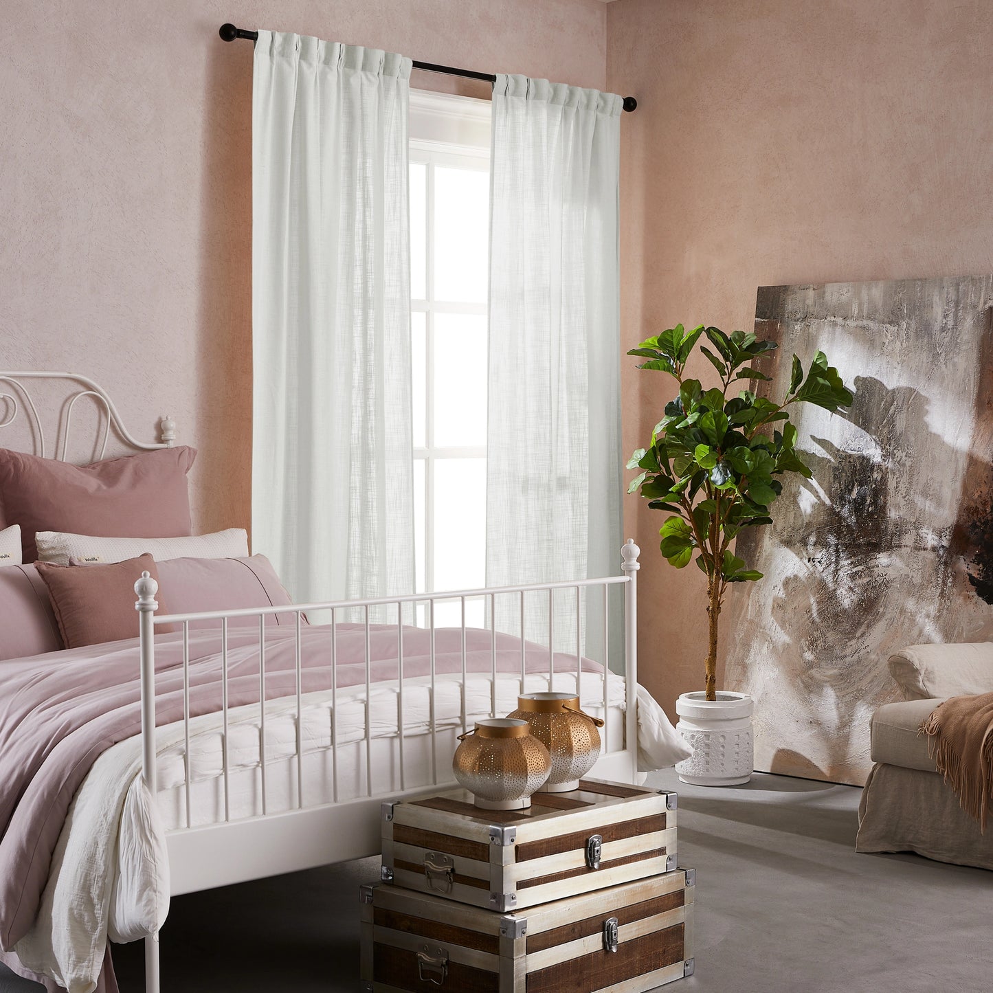 Bedroom with pink walls, white bed, decorative elements, and elegant soft pure white linen-polyester mix pleated curtains.