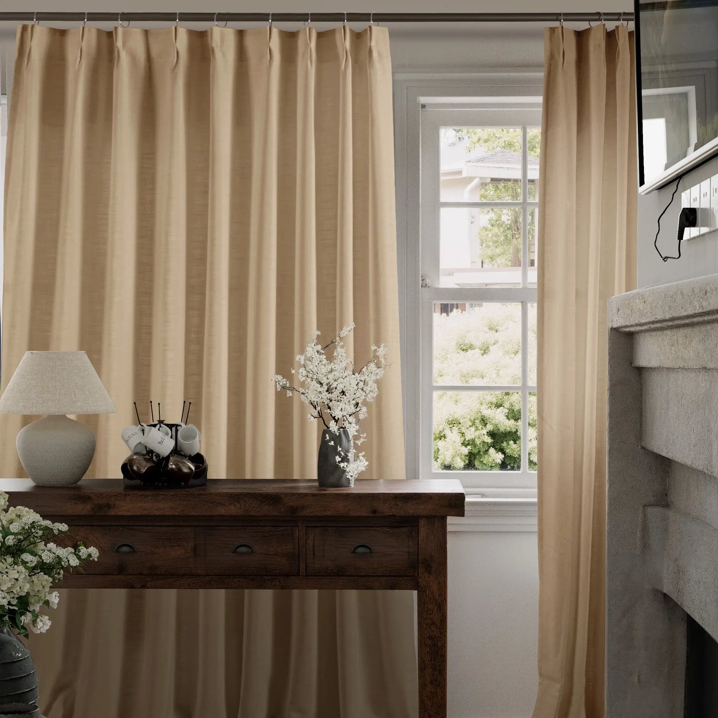 Oatmeal curtains hanging in a room with a wooden table and decorative items.