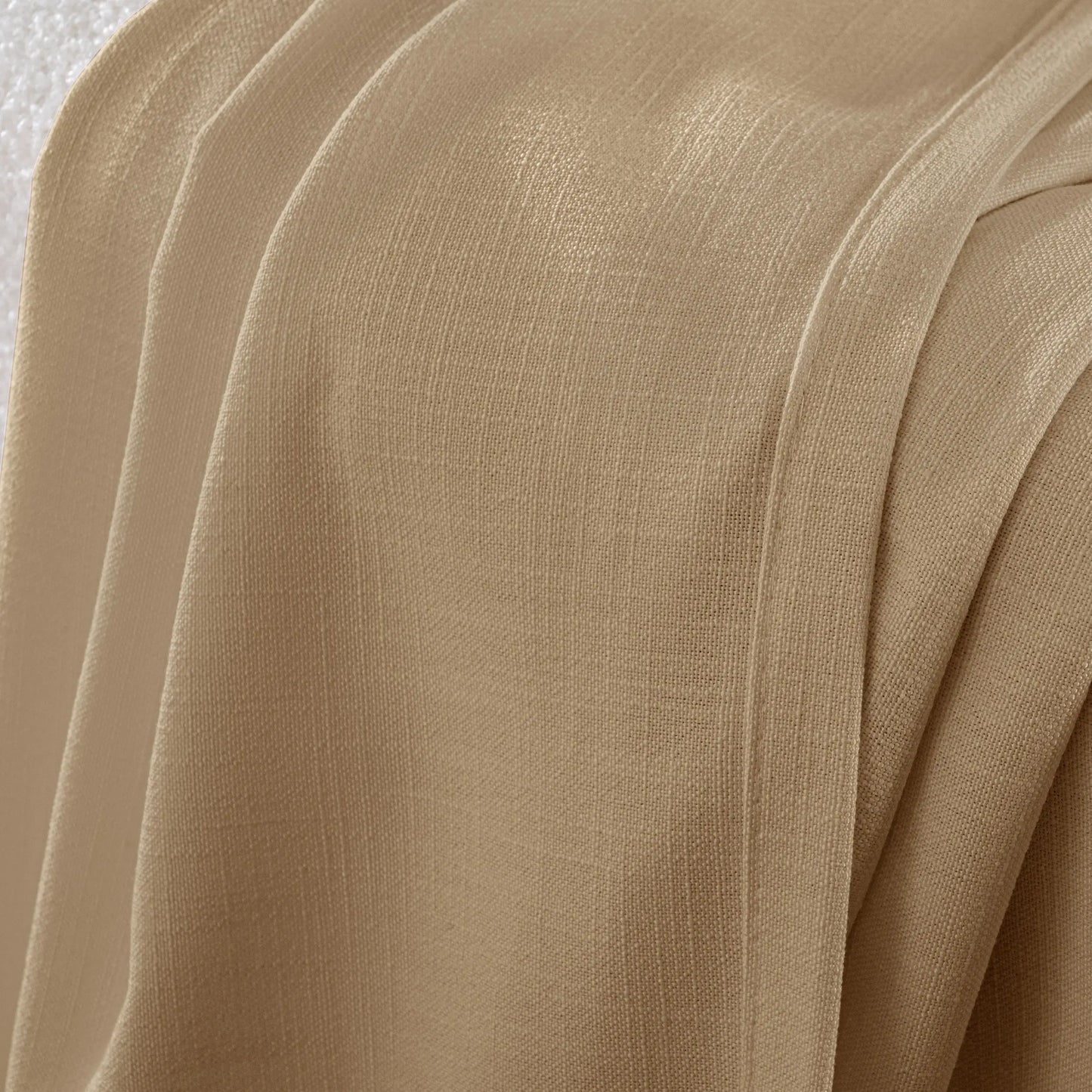 Close-up of fawn fabric with folds