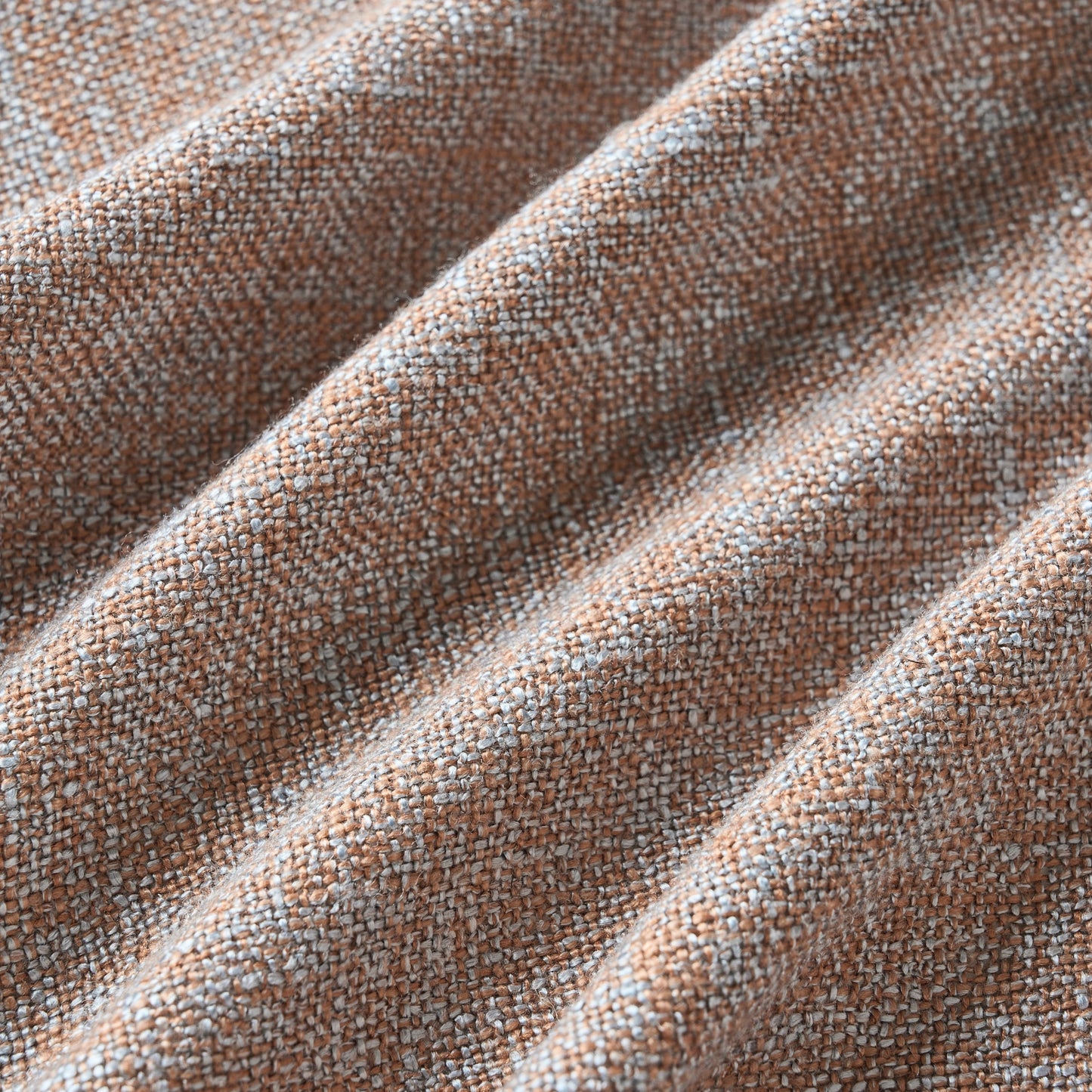 Soft terracotta poly-viscose-linen blend curtain detail showing fabric texture.