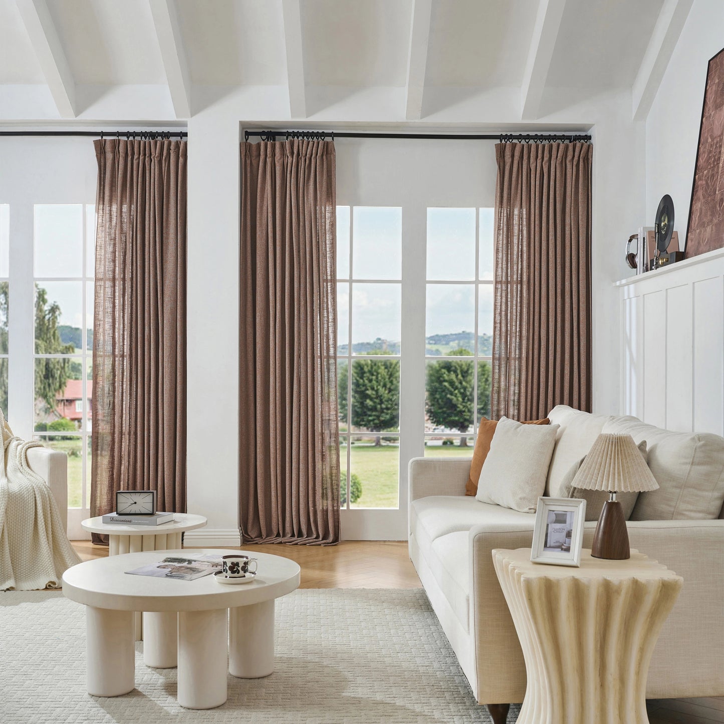 Modern living room with earthy brown poly-viscose-linen curtains, sofa, and tables.