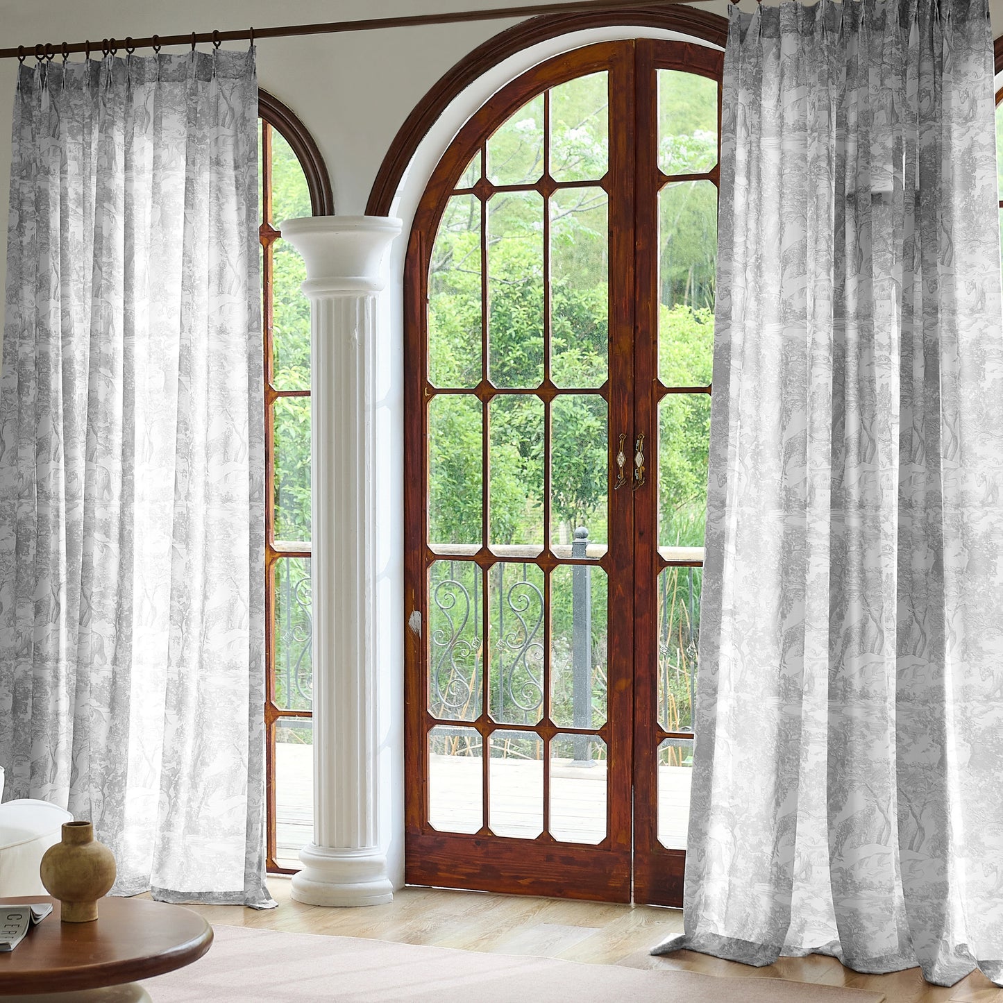 Gray toile sheer curtains softly diffusing daylight, creating a calm and elegant interior