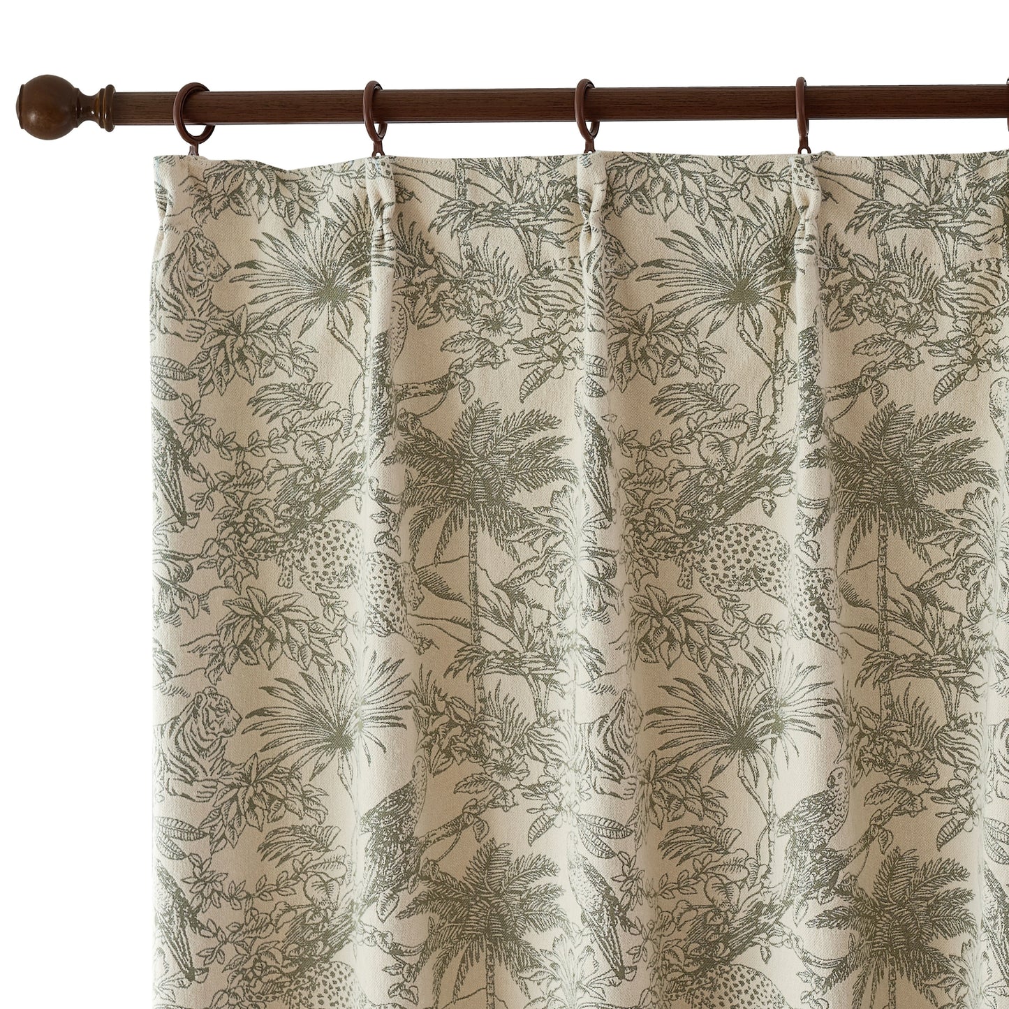 Close-up of sage toile pinch pleat curtain textile, cashmere-like surface showing detailed green botanical designs.