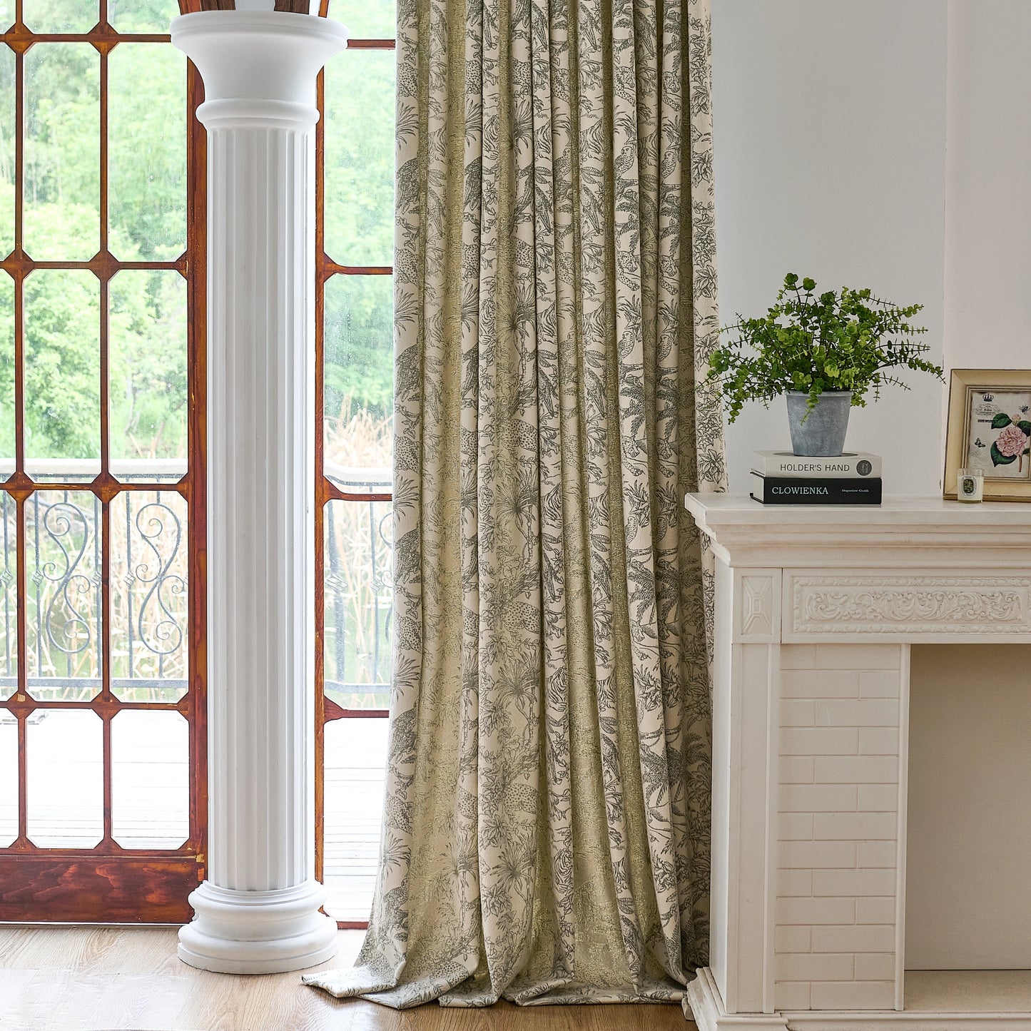 Room decorated with moss toile fabric curtains, featuring a fireplace and window.