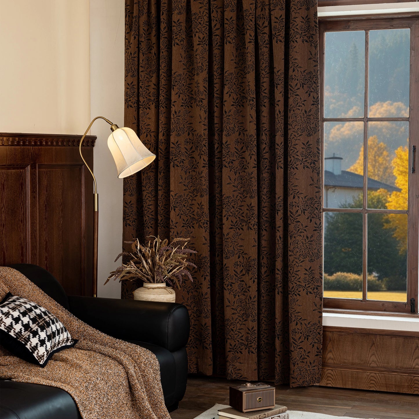 Cozy living room with draped vintage chestnut curtains with a deep floral design, lamp, and sofa.