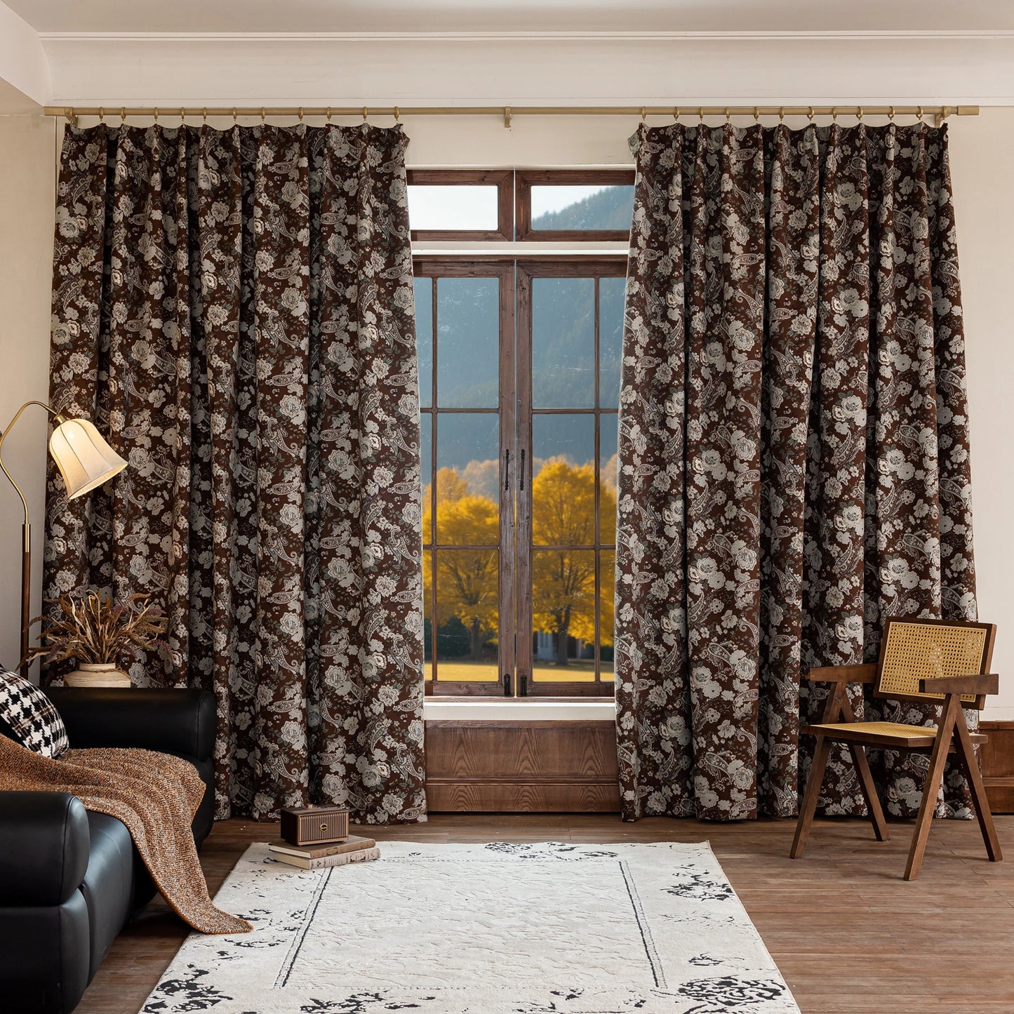 Living room with classic vintage floral curtains, sofa, rug, chair, and lamp, styled for a cozy, elegant look.