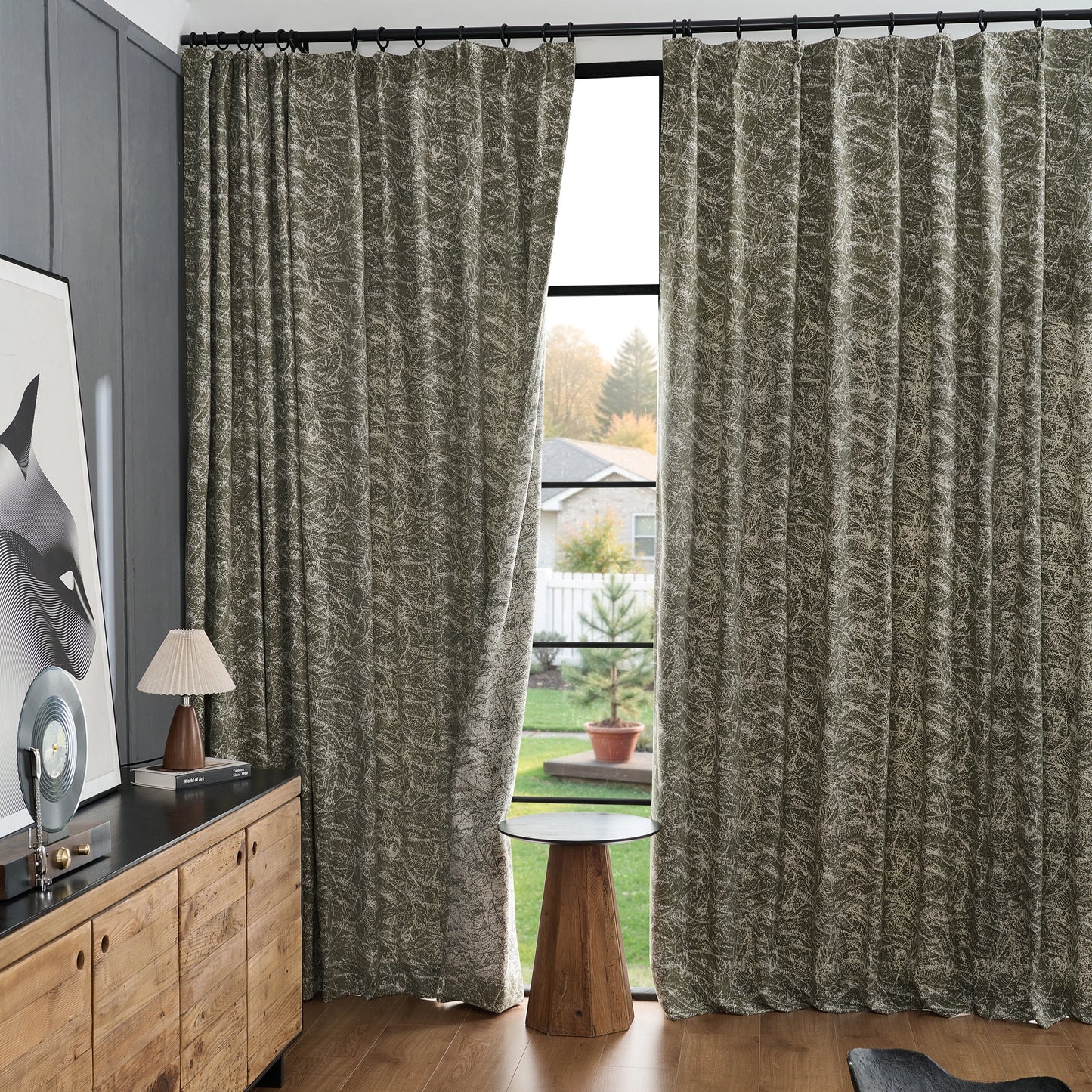 Interior styled with vintage fern curtains featuring paint stroke texture, complemented by wooden furniture.